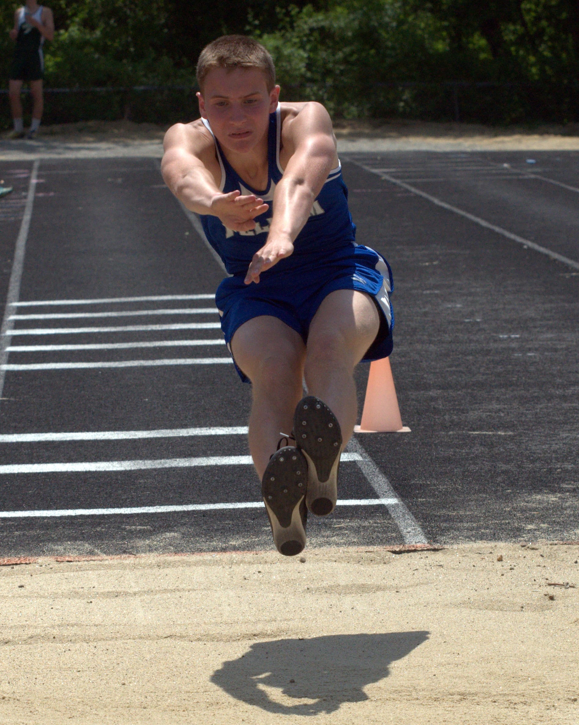 Pelham's Jared Hannon competes in the long jump.