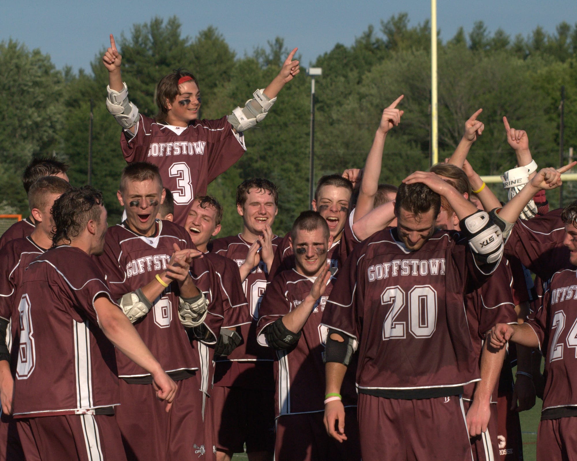 Goffstown celebrates after beating Derryfield in the Division II championship game.