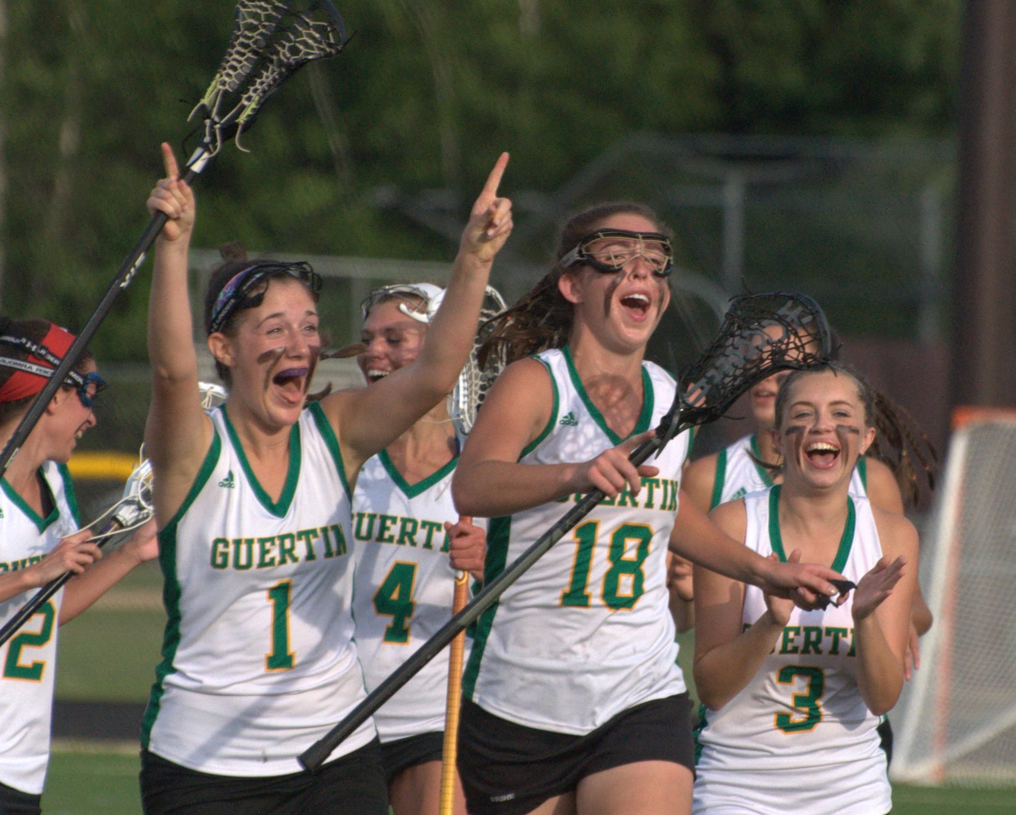 Bishop Guertin celebrates after beating Exeter in the Division I final.