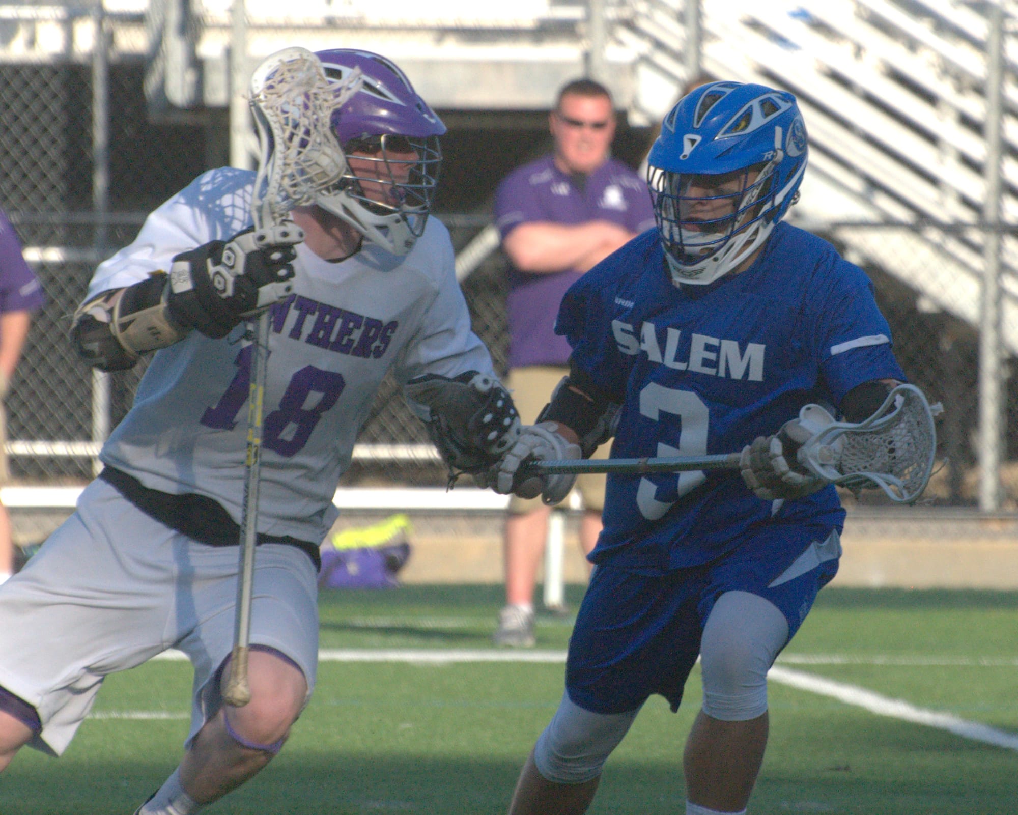Nashua South's Jesse Clauss tries to get by Salem's Adam Maroun.