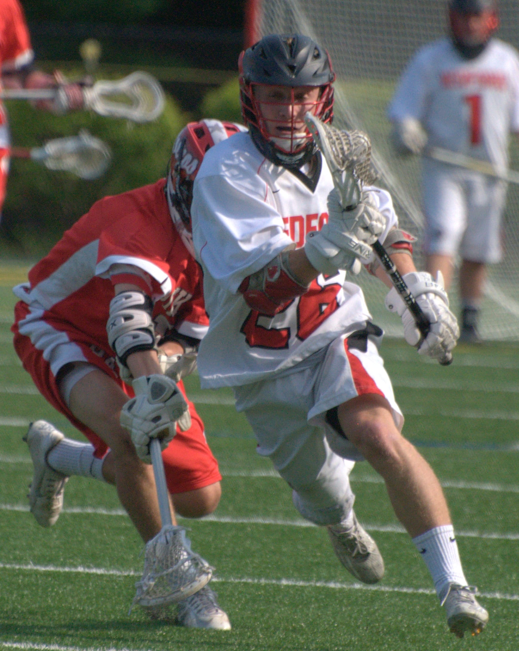 Bedford's Colin Cashin runs down the field after winning a faceoff.