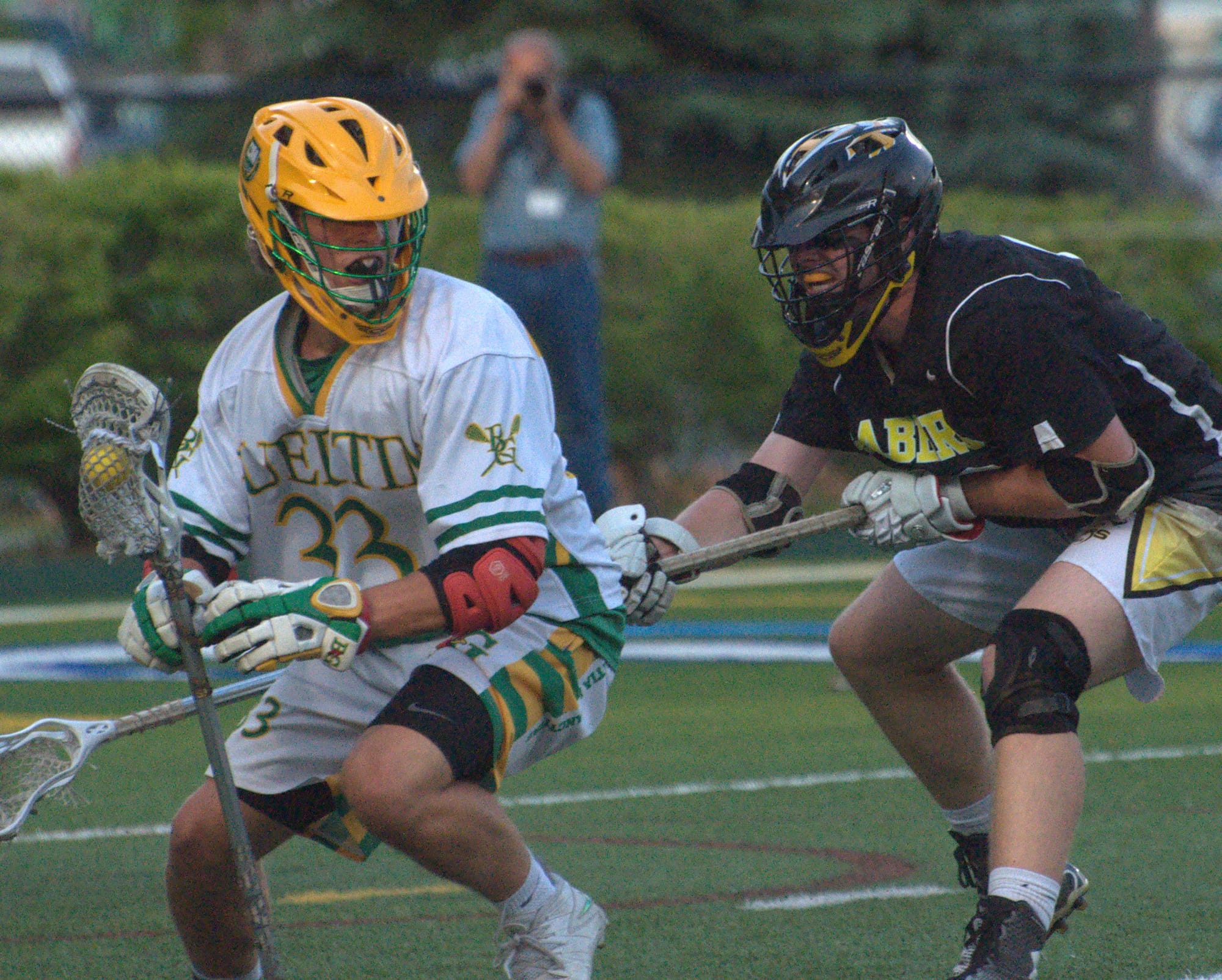 Souhegan's Foster Burnley tries to slow down Bishop Gueritn's Alex Astarita during Wednesday's Division I semifinal.