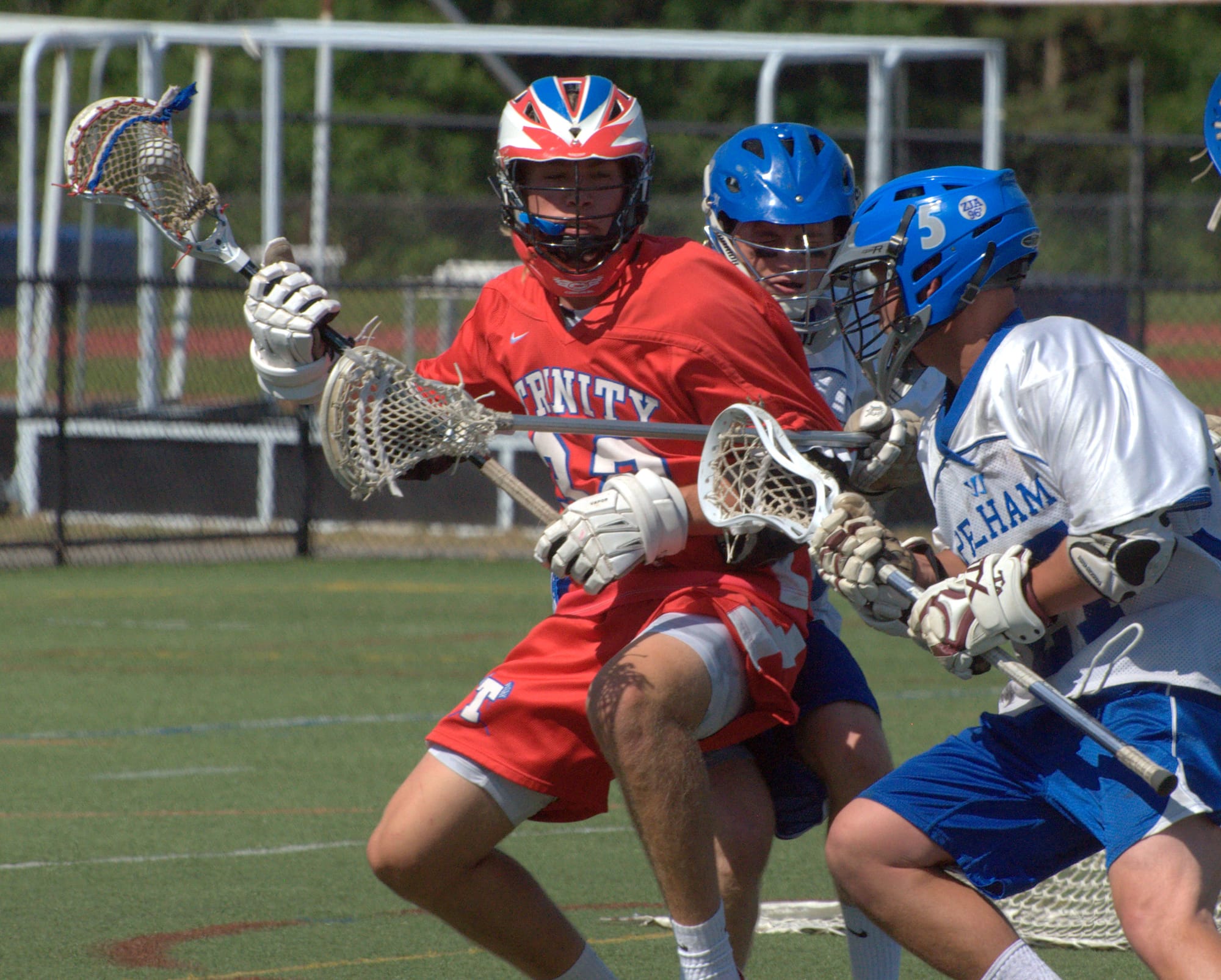 Trinity's Will Towner gets double-teamed by Pelham's Zach Massiello, right, and Michael Calistro during Saturday's championship game.