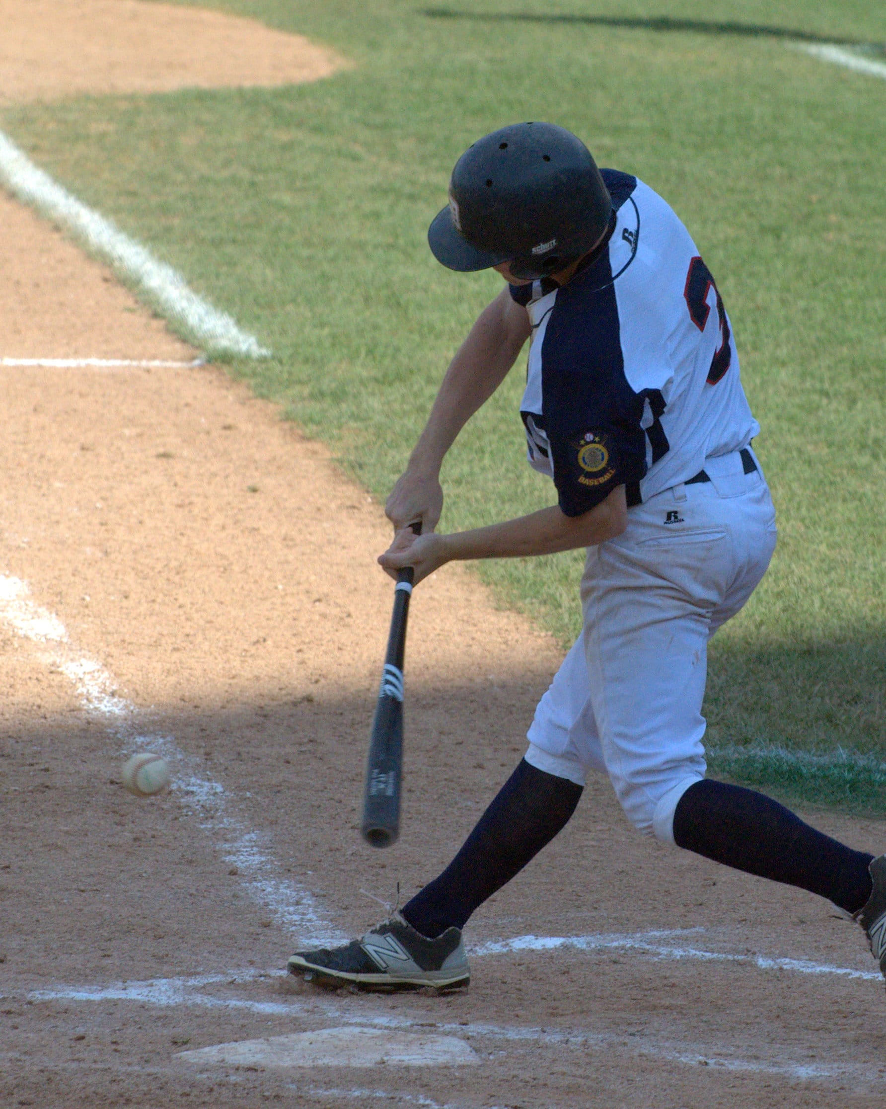 Dover's Jared Gagne takes a swing.