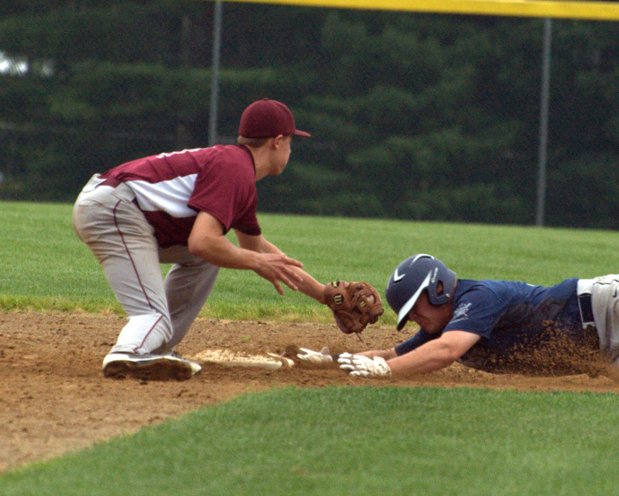 Exeter's Henrik Barbin slides safely into second base as Merrimack's Zach Amodio tries to make the tag.