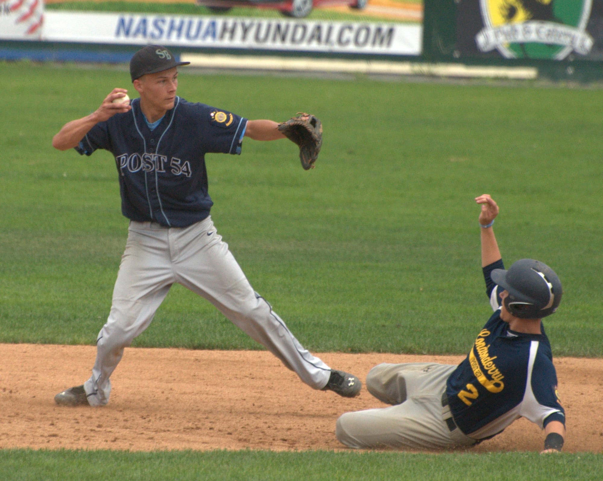 Londonderry's Jonathon Meskall slides into second as Bedford's Bryan Fyfe tries to complete a double play.