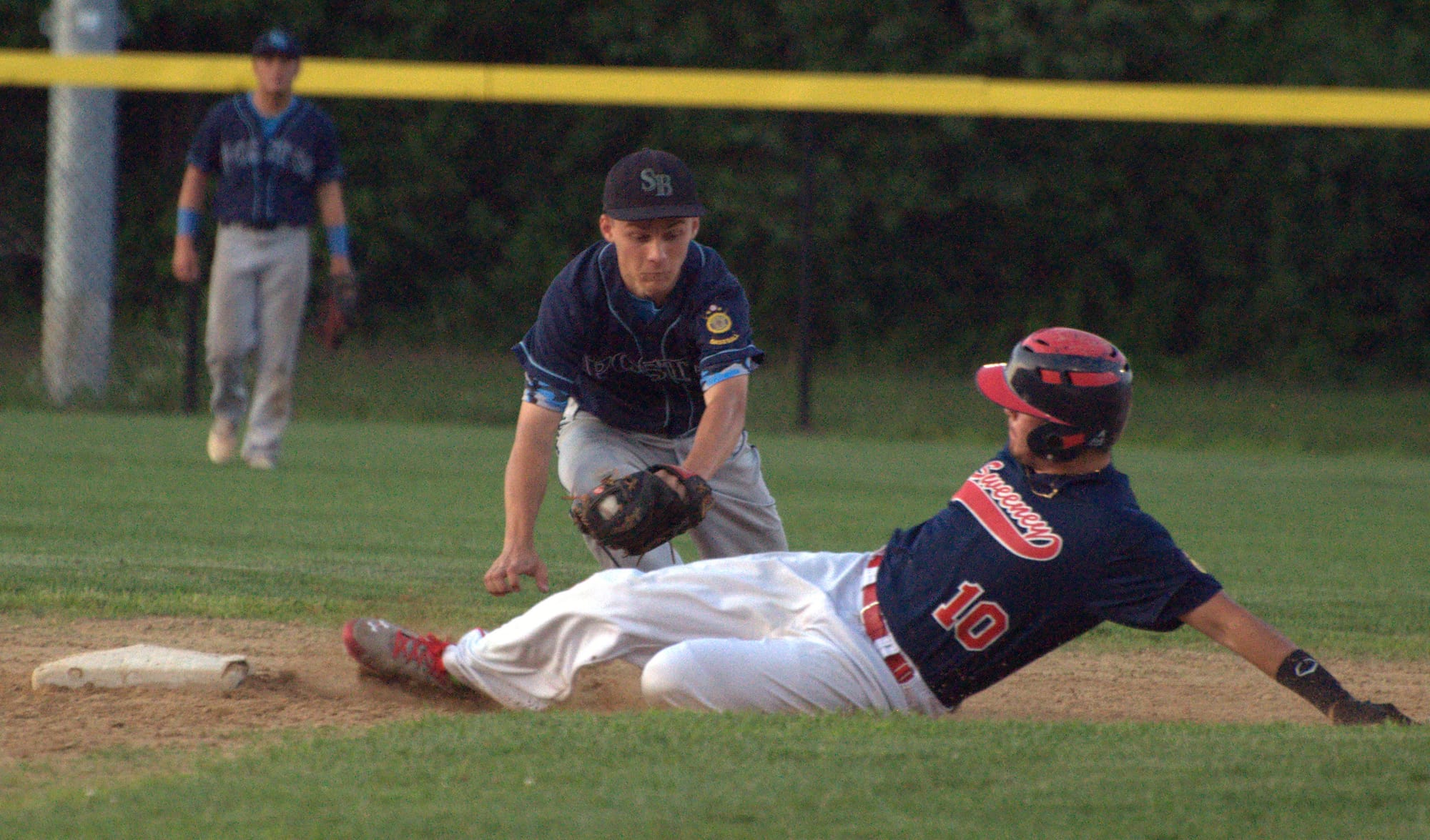 Sweeney's Brendan Sullivan slides safely into second Friday night before Bedford's Brian Fyfe can make the tag.