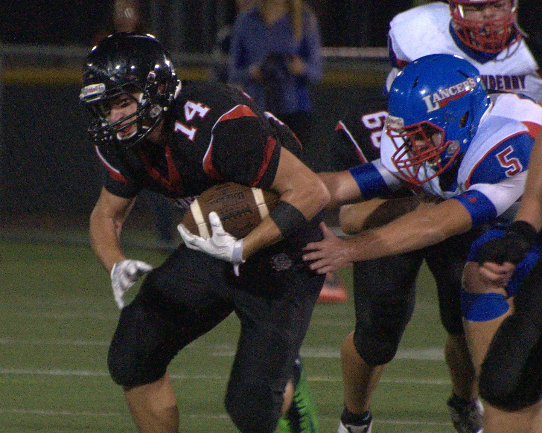Bedford's Nicholas Leahy gets away from Londonderry's Brandon Radford.
