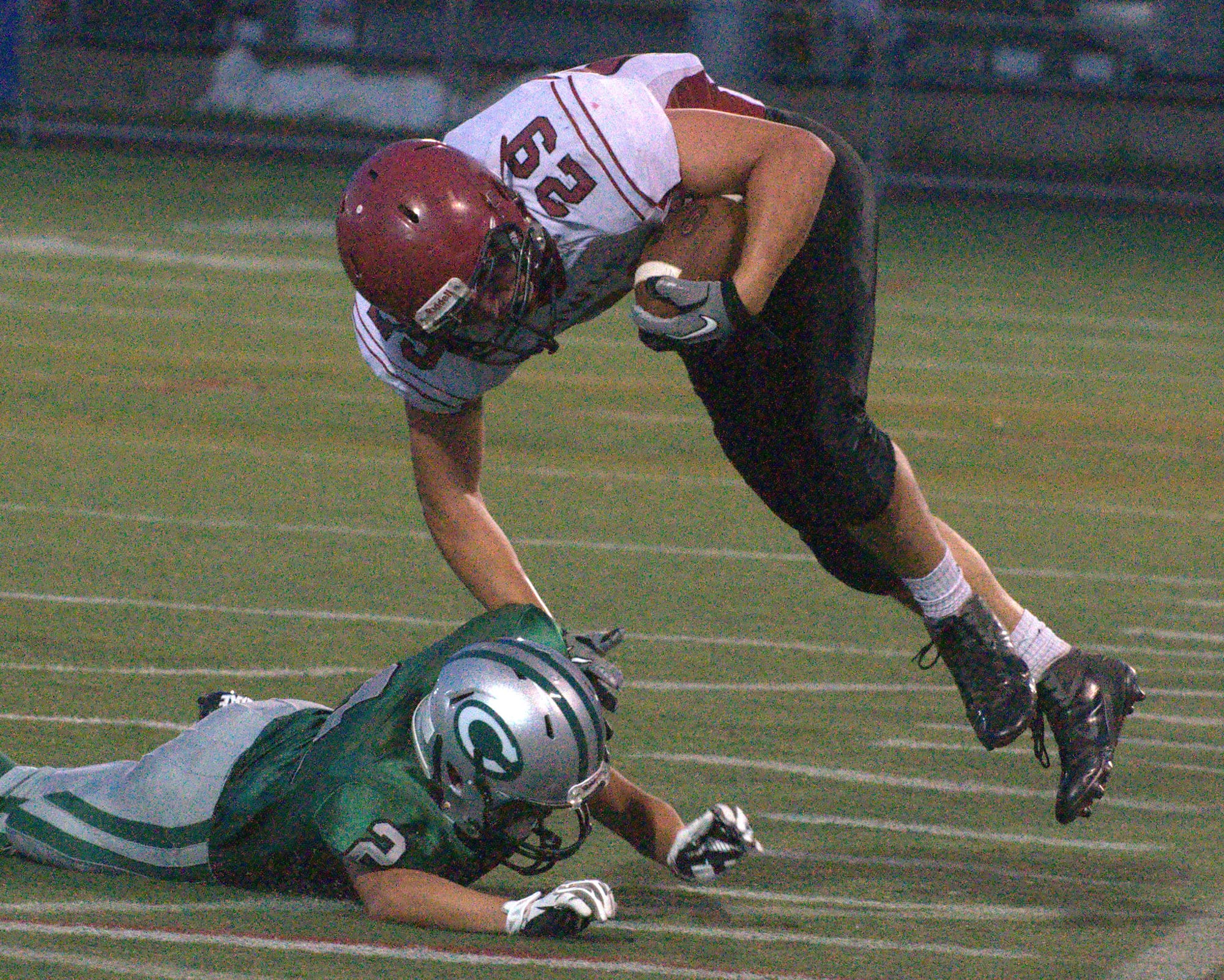 Timberlane's Kyle Faucher fights off a tackle by Central's Jason Lam.