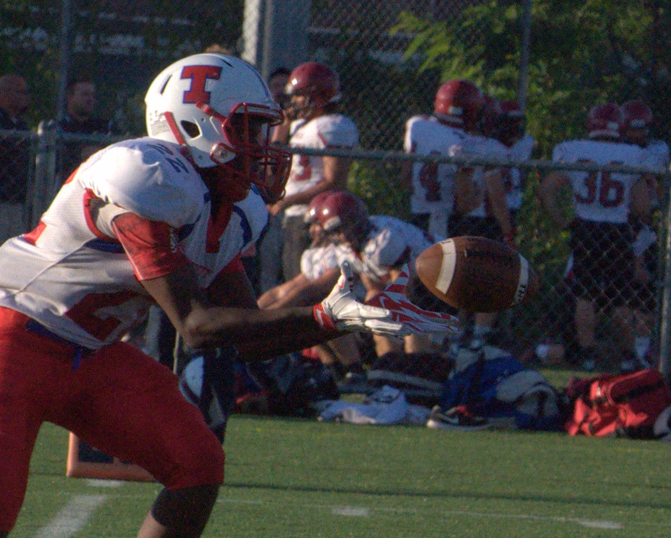 Trinity's Javell Desir hauls in a pass.