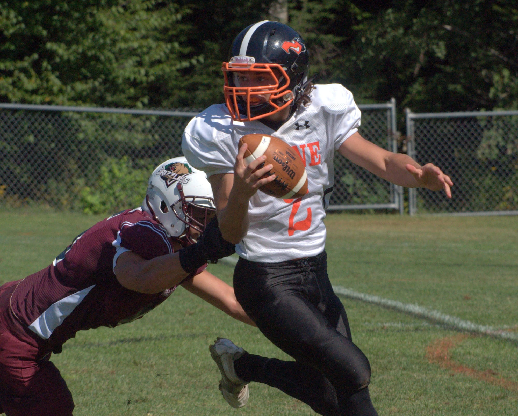 Keene's Hunter Massucco gets away from Goffstown's Joey Poisson.
