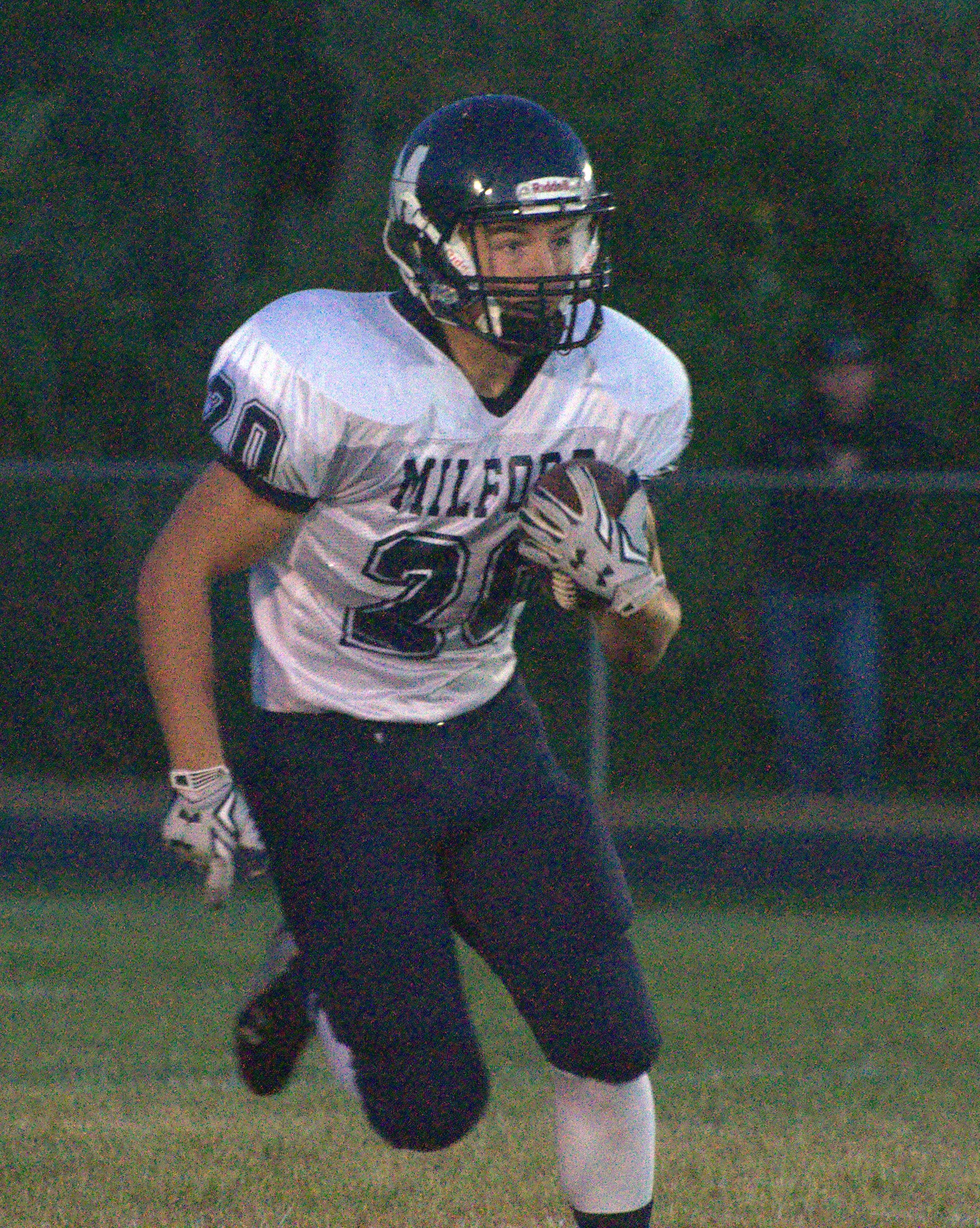 Milford's Mark Madigan carries the ball.
