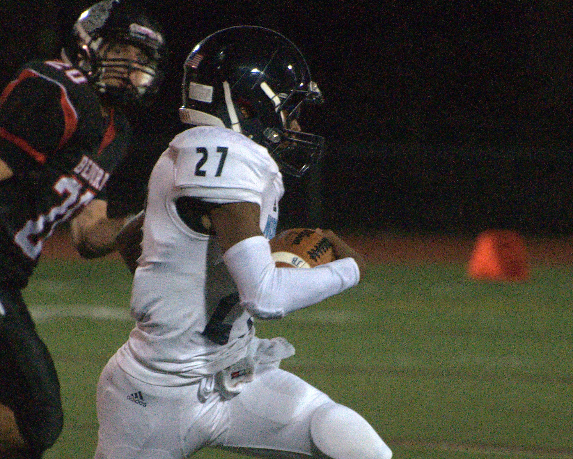 Nashua North's Sclyler Boykin carries the ball.
