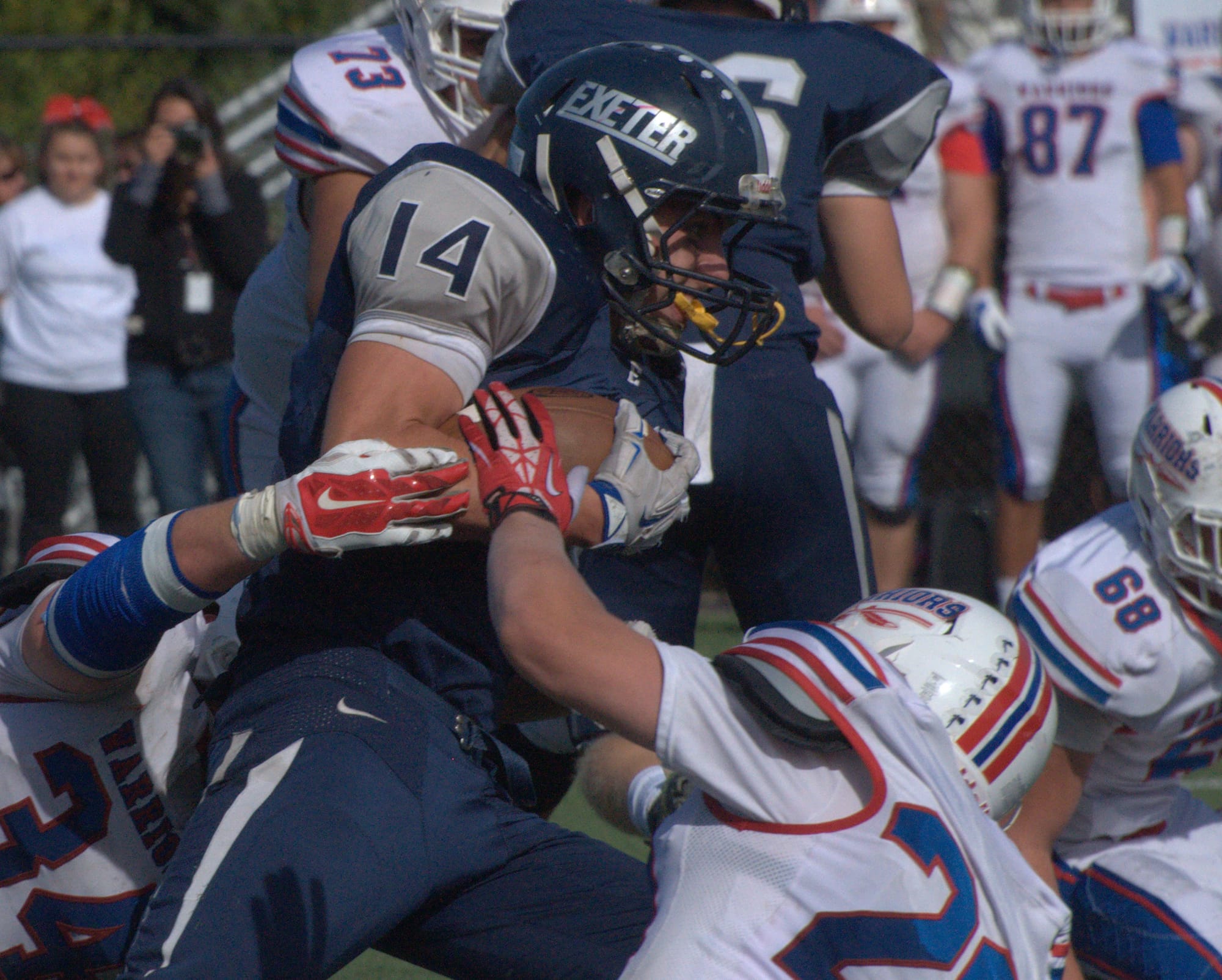 Exeter's Jackson Allen carries the ball.