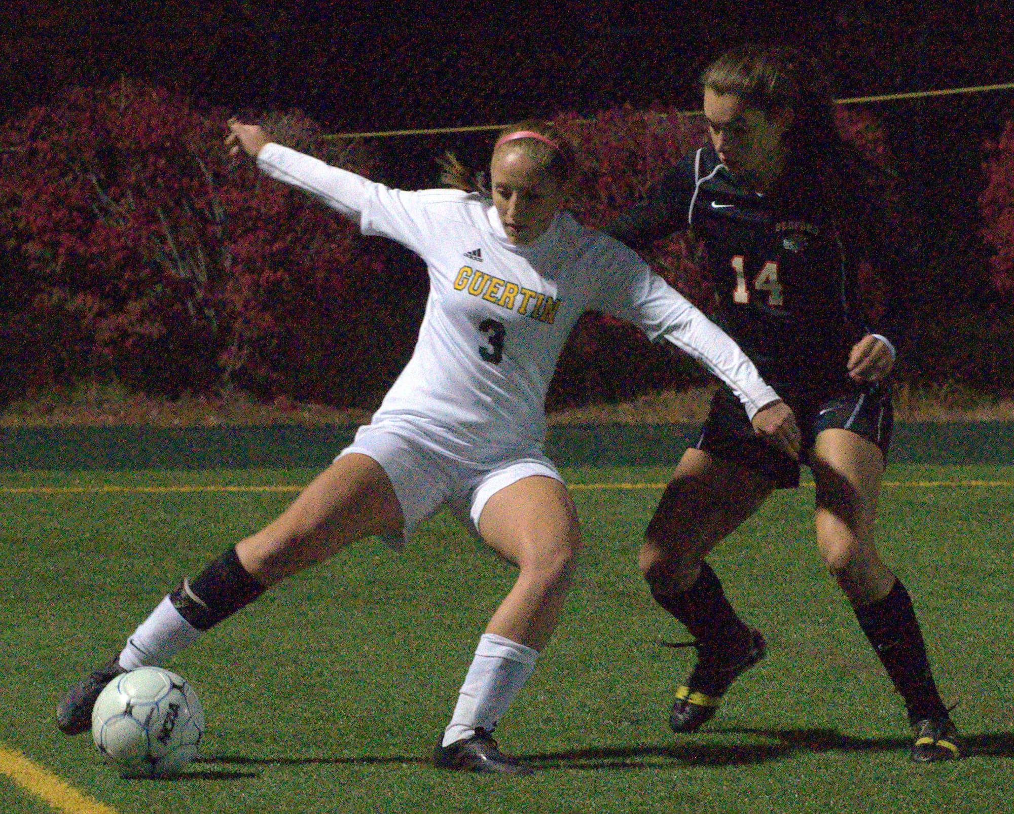 Bishop Guertin's Marie Laplante tries to get around Bedford's Brianna Coro during Monday's game.