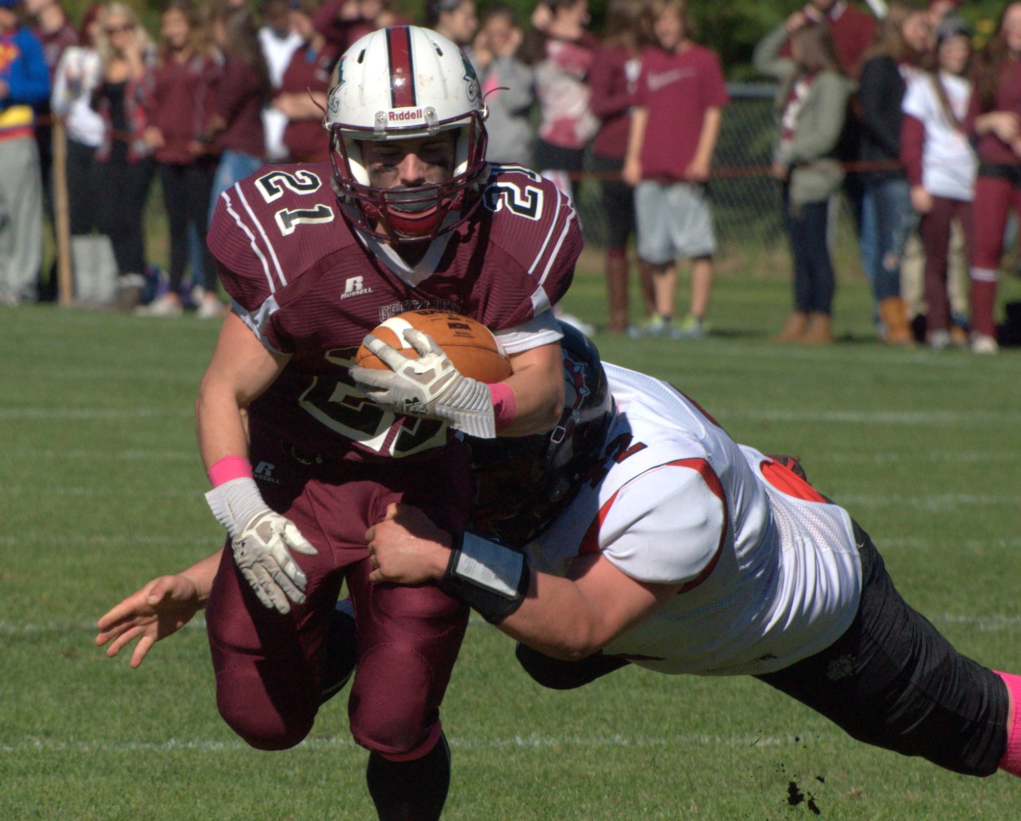 Bedford's Bobby Heald tackles Goffstown's Connor Bourque.
