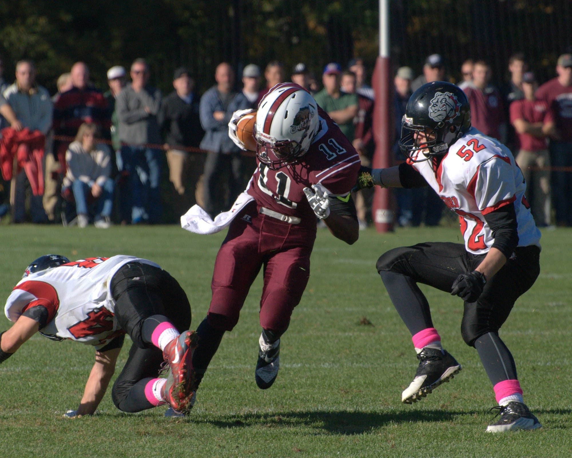Goffstown's Franklin Castillo Diaz tries to avoid Bedford's Connor Collins, left, and Alex Abad during Saturday's game.