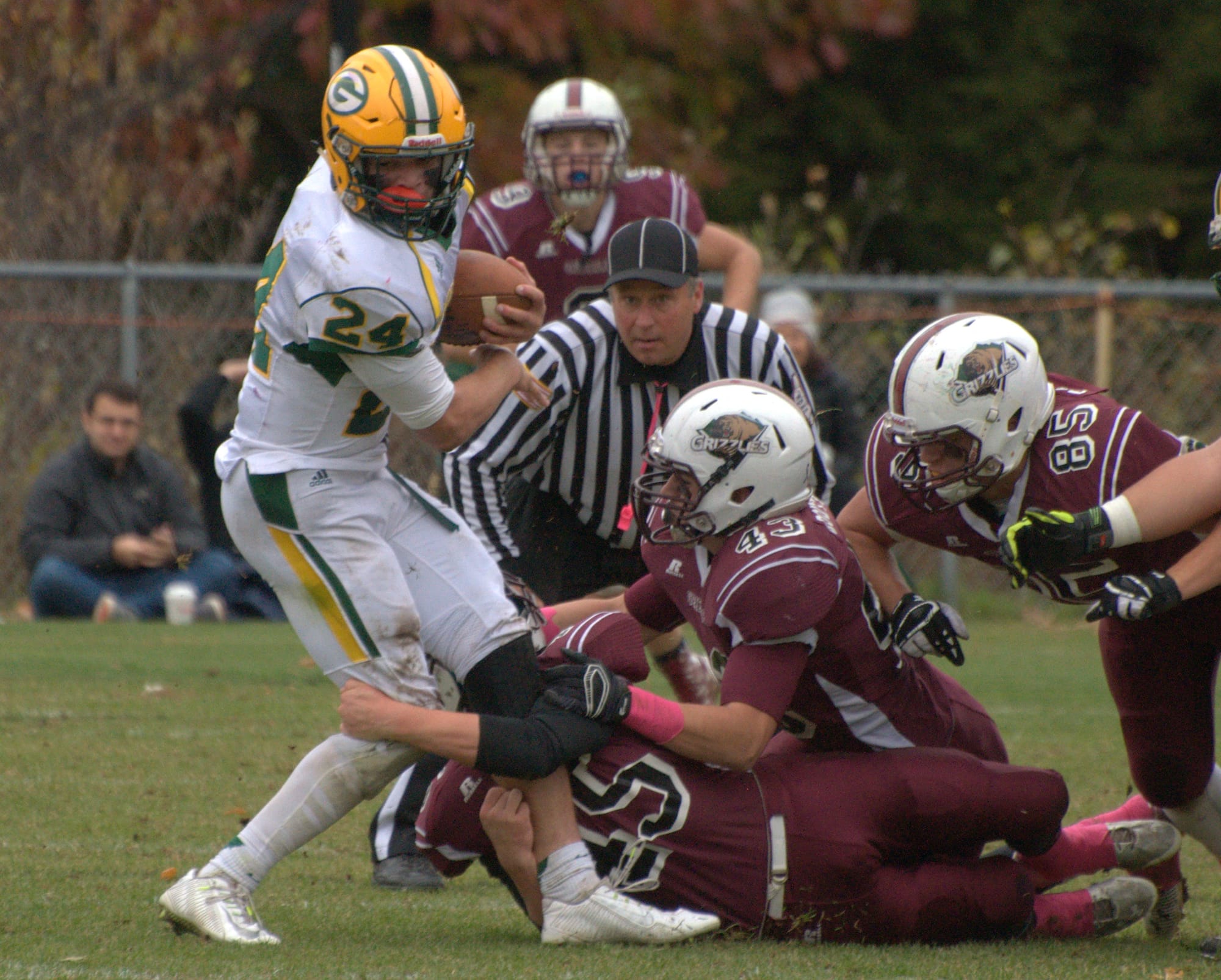 Bishop Guertin's Jackson Housman tries to spin away from Goffstown's defense.