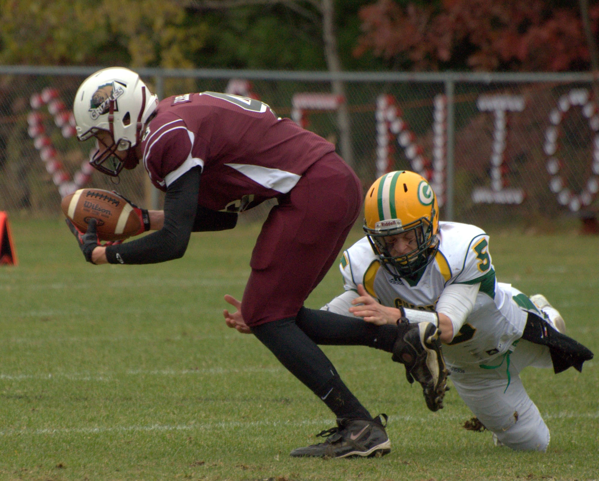 Bishop Guertin's JT Hiscoe tries to trip up Goffstown's Pat Leahy.