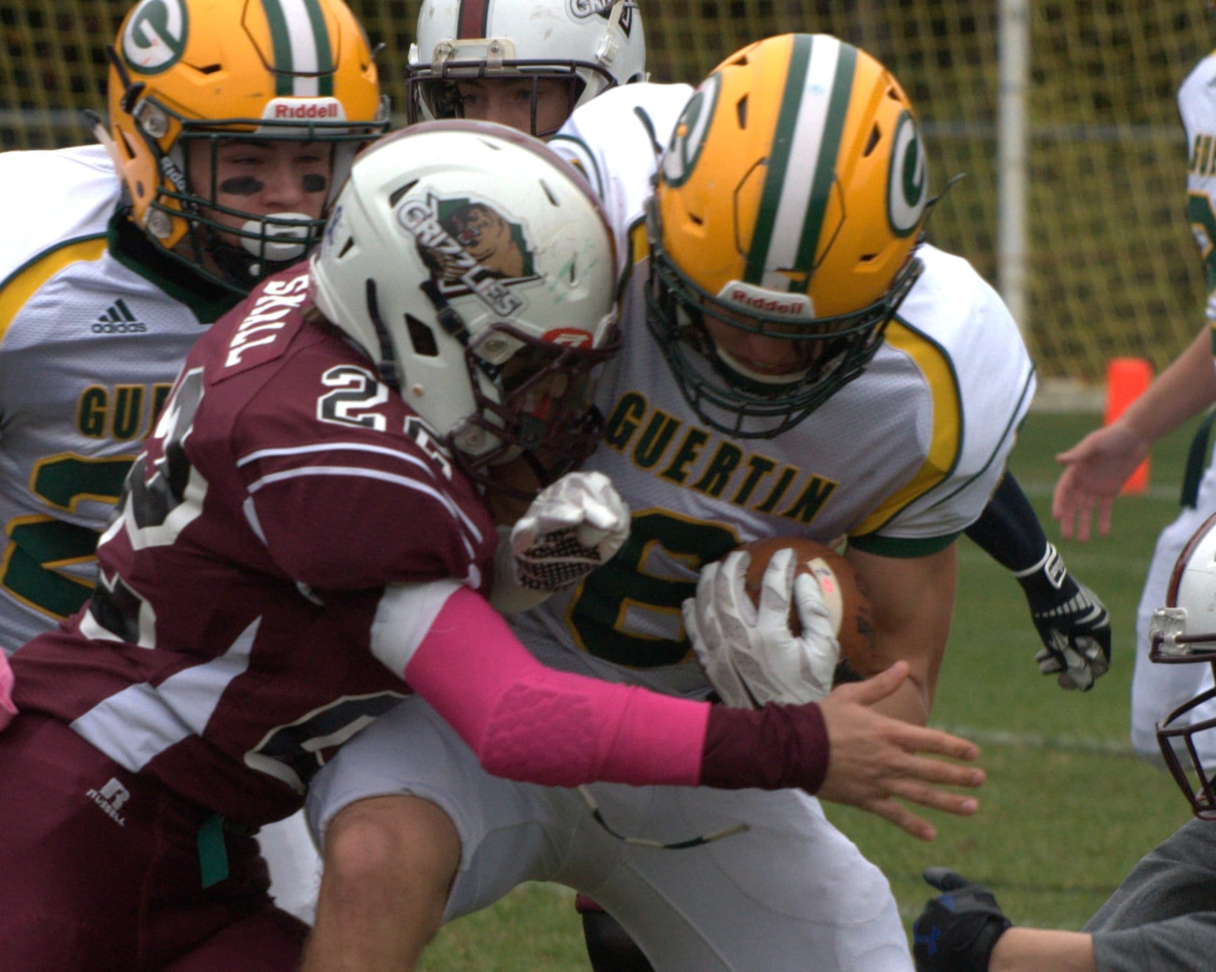 Goffstown's Tyler Small tries to wrapup Bishop Guertin's Chase Hughes.