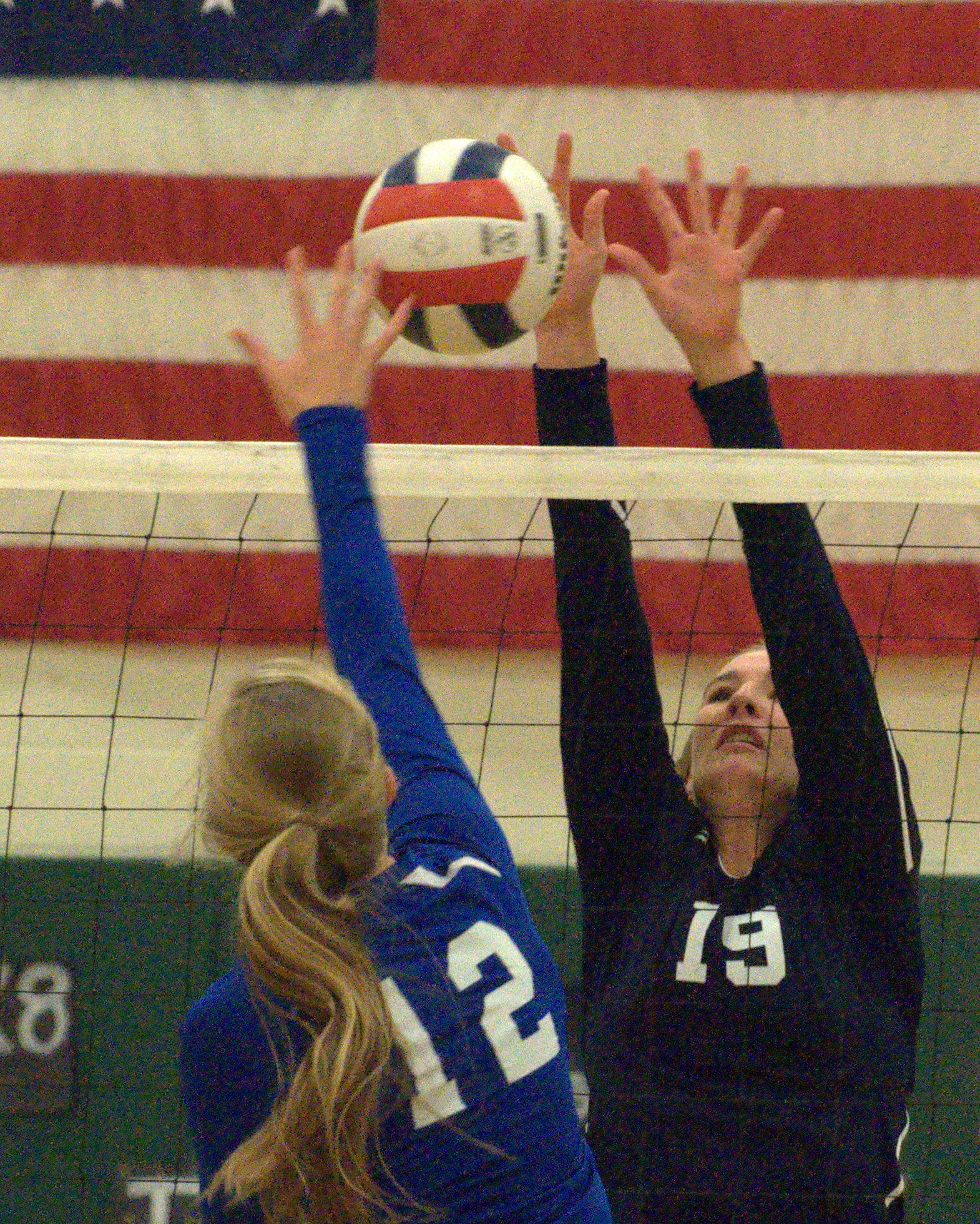 Windham's Casey Dinga tries to block a ball hit by Somersworth's Jamie Sharpe.