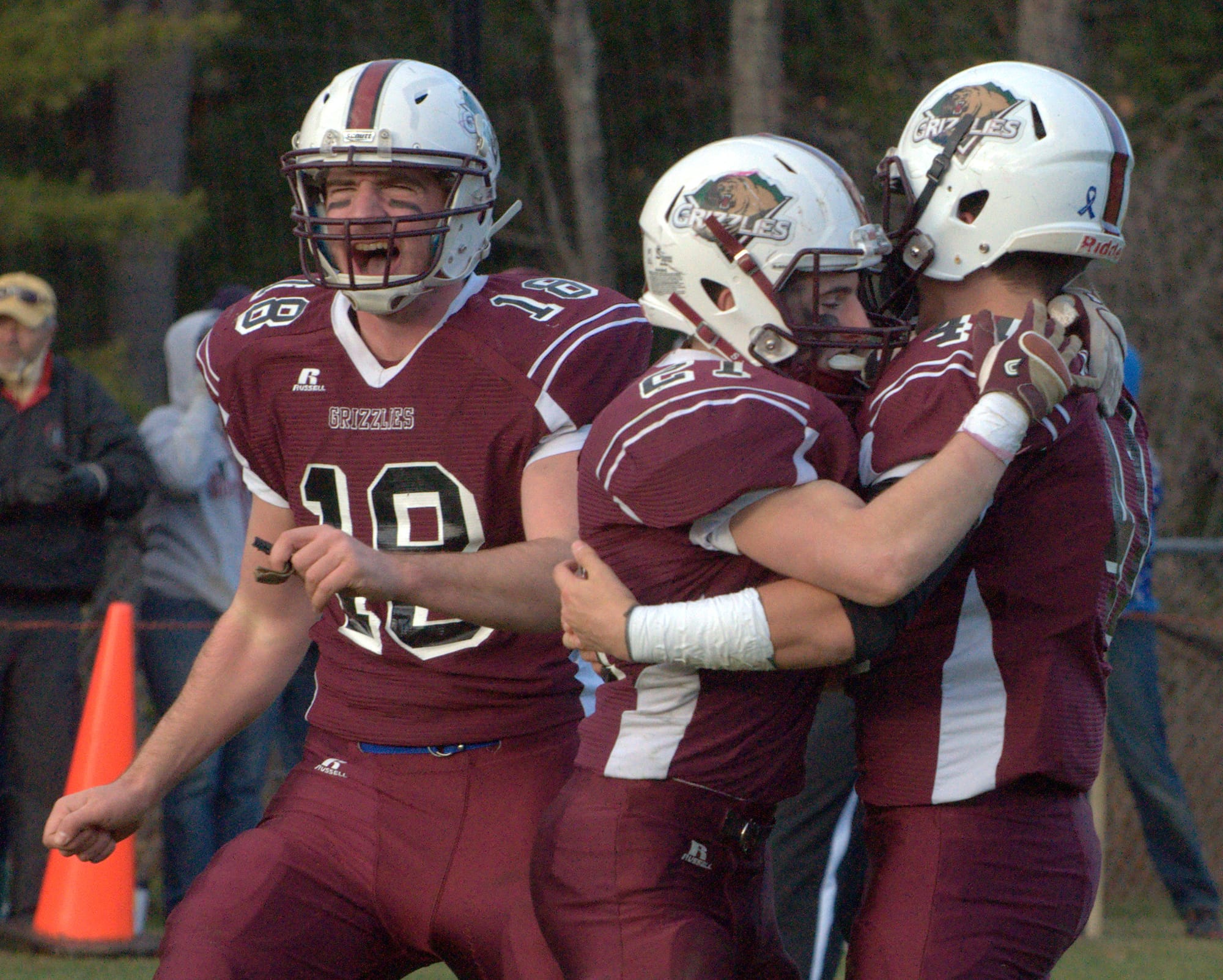 From left, Gofftown's Casey Gervais, Connor Bourque and Carter Cormier celebrate after Bourque's game-winning touchdown Saturday against Bedford.