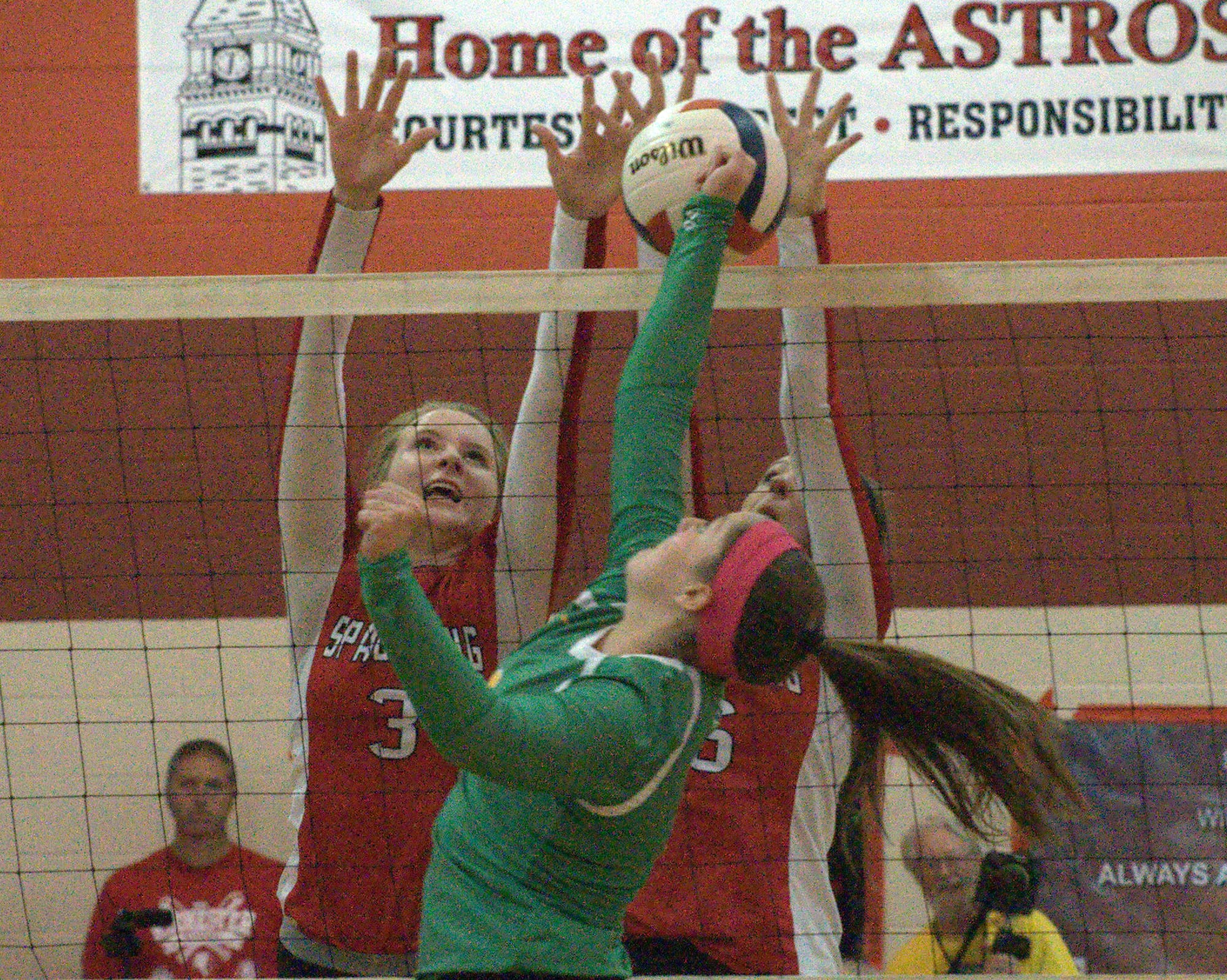 Spaulding's Olivia Noonan, left, and Cassandra Wachowiak block a ball hit by Bishop Guertin's Jenna McCormack.