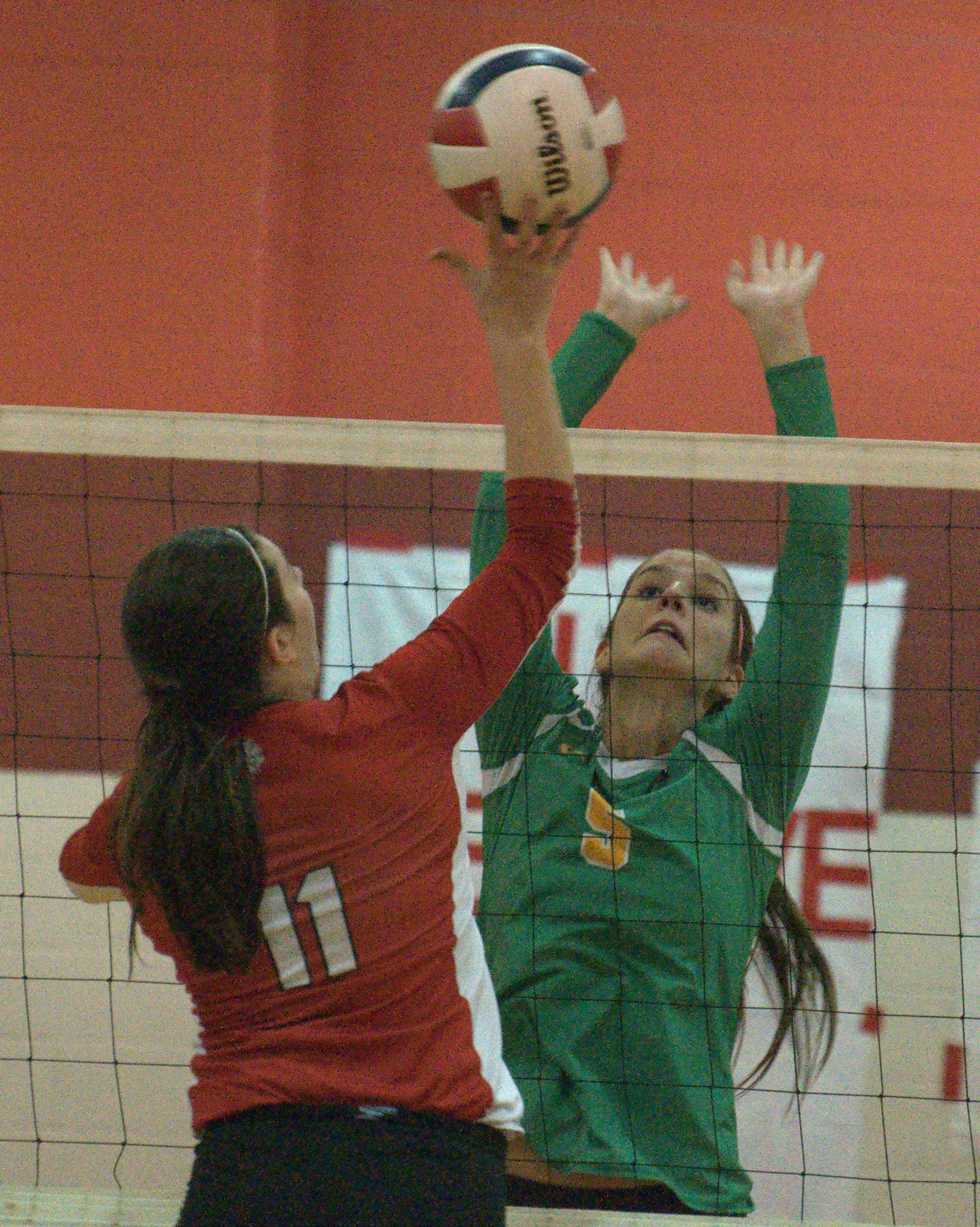 Bishop Guertin's Margaret Richardson tries to block a ball hit by Spaulding's Faith George.
