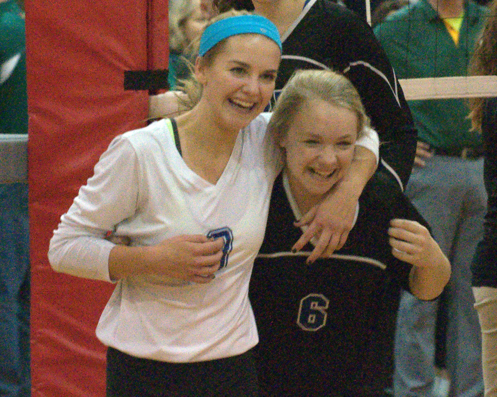 Hollis Brookline's Bella Zampieri, left, and Sierra Dinman celebrate Saturday's win.