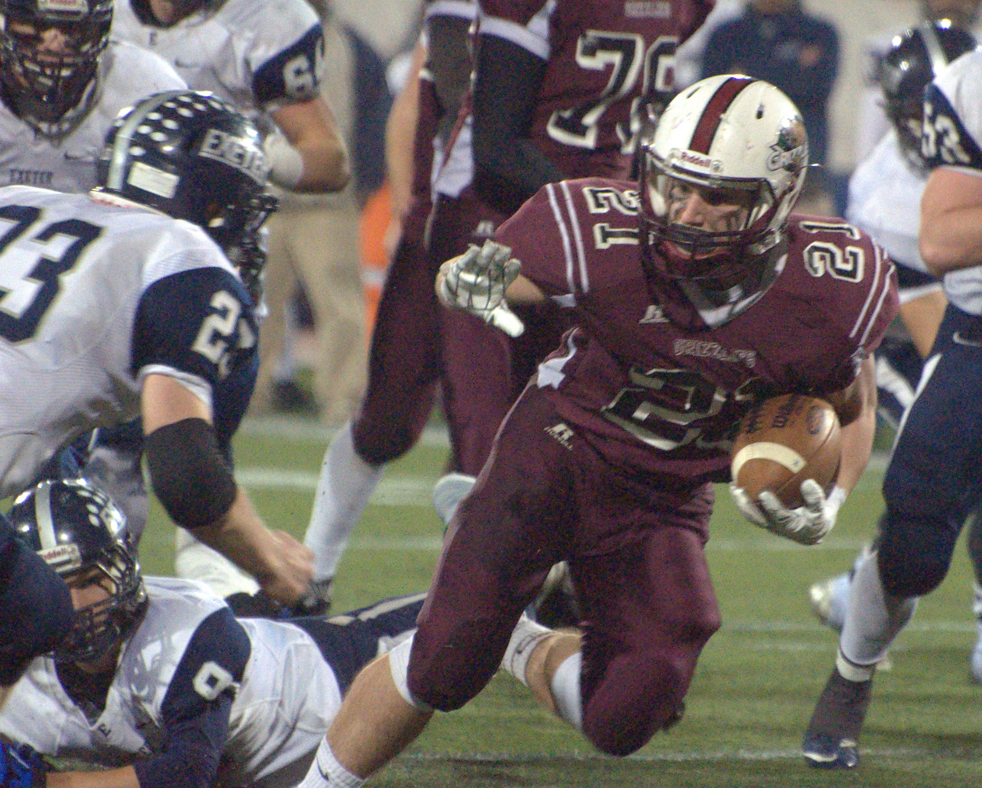 Goffstown's Connor Bourque tries to avoid a tackle.