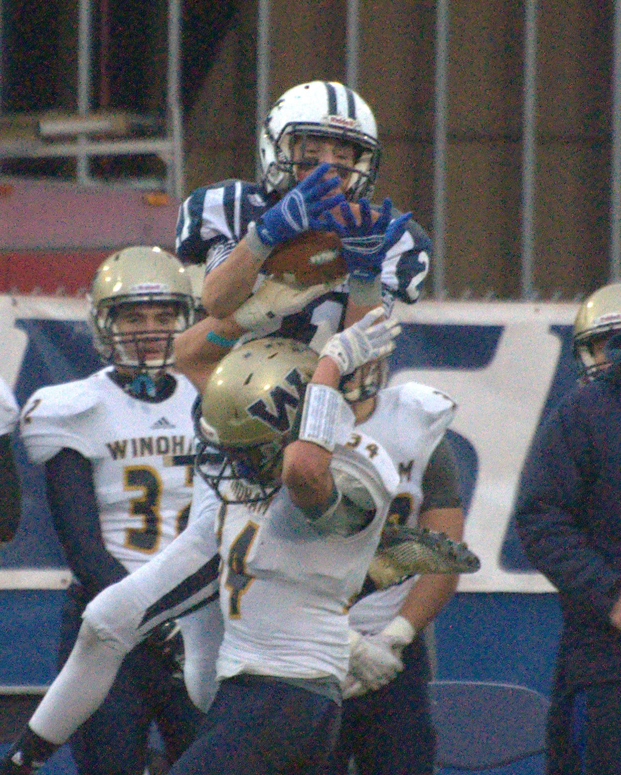 Windham's Shane LaFond breaks up a pass to St. Thomas' Nate Grunbeck.