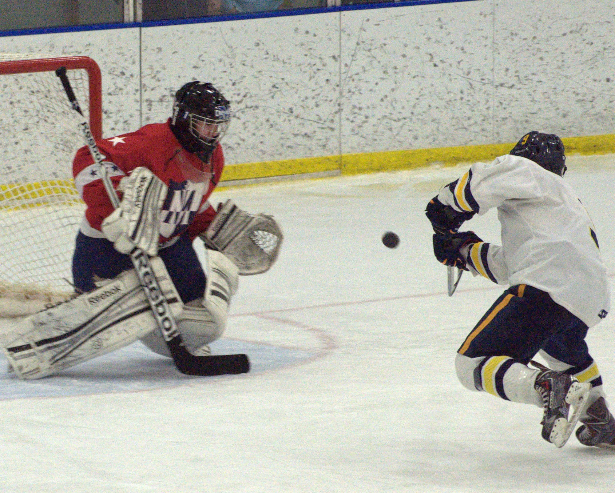 Bow's Josh Connor sends a shot at Memorial goalie Jarrod Broussard.