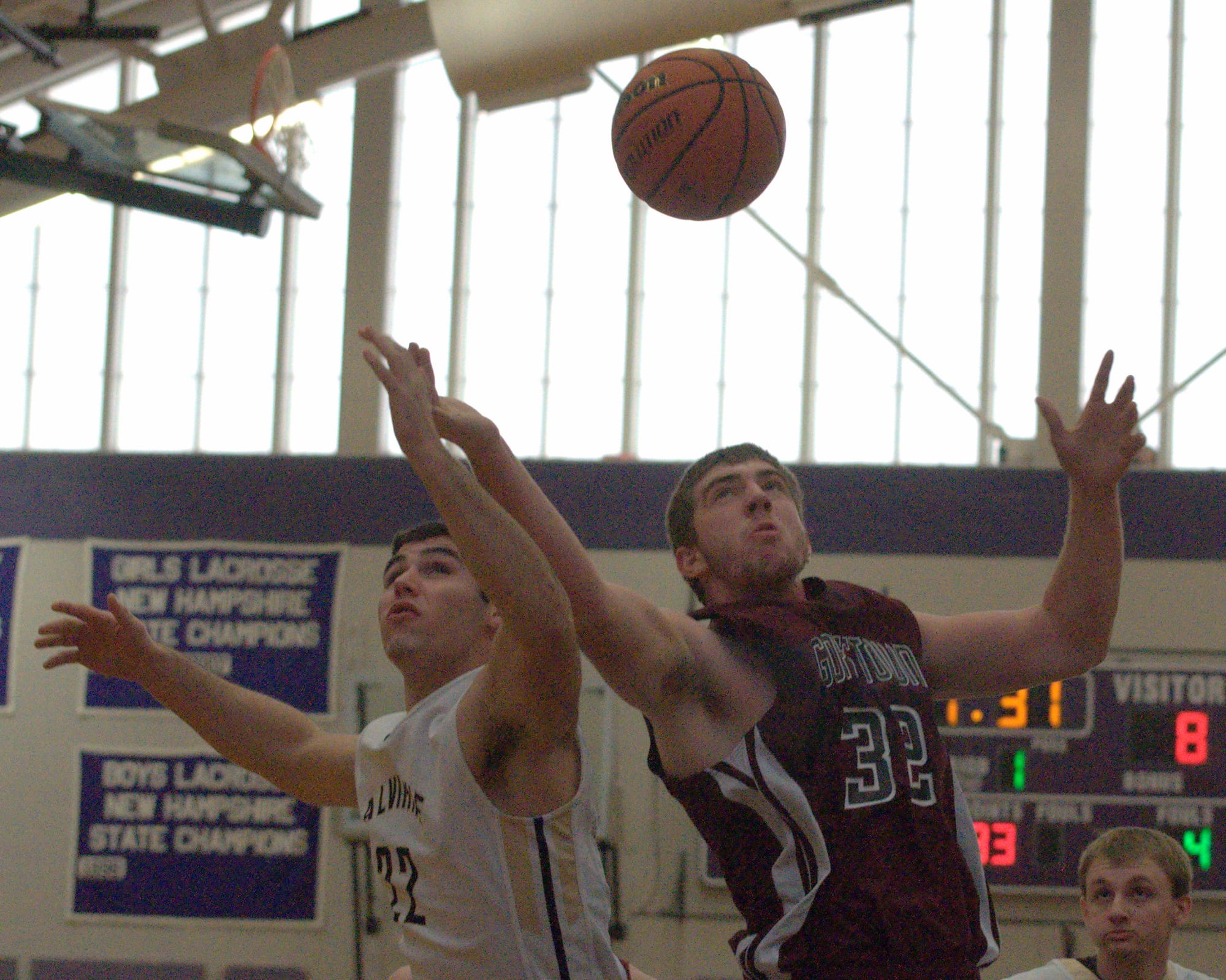 Alvirne's Jake Canelas and Goffstown's Casey Gervais battle for a rebound.
