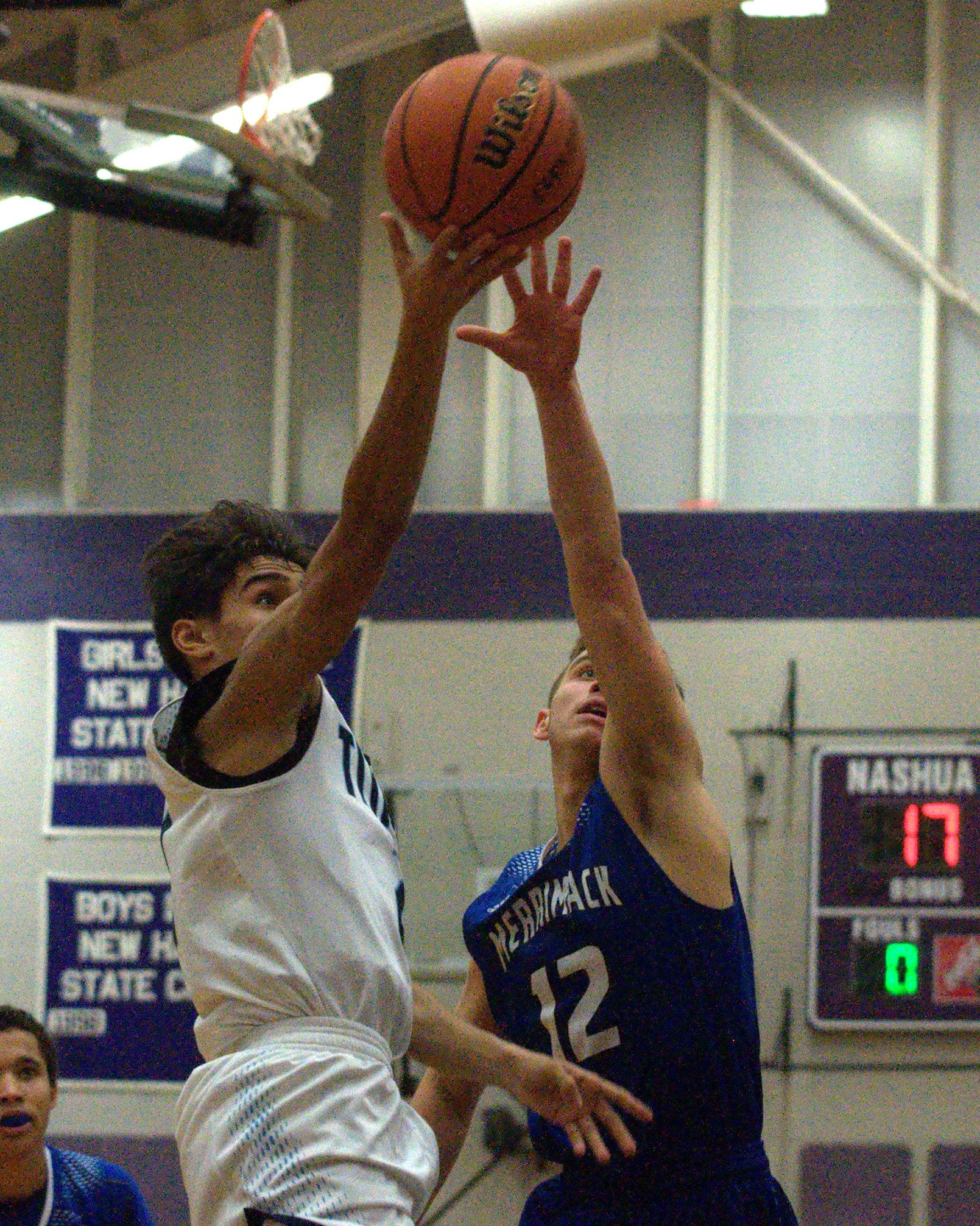 Nashua North's Ronnie Silva drives to the basket against Merrimack's Mike Dudash.