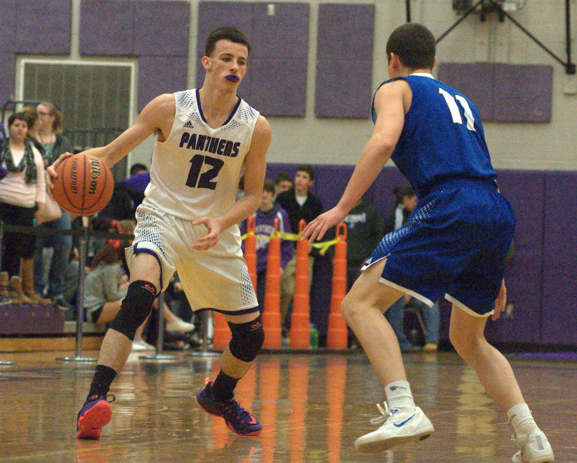 Nashua South's DJ Frechette looks to drive around Merrimack's Andrew Wojiack.