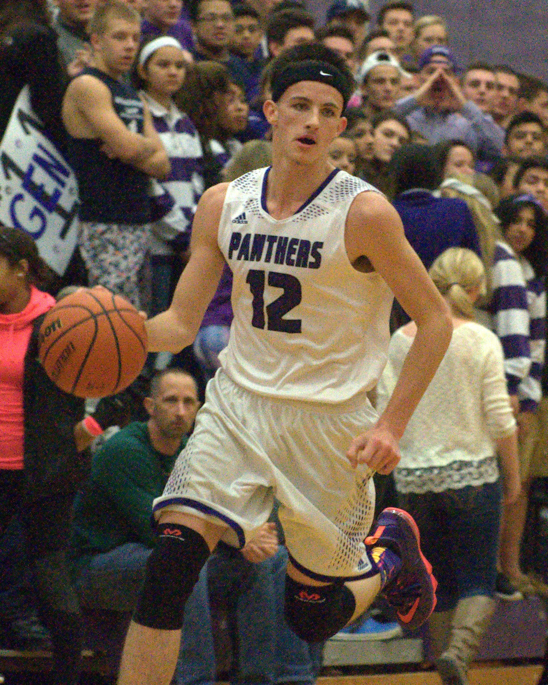 Nashua South's DJ Frechette brings the ball down the court during Friday's game.