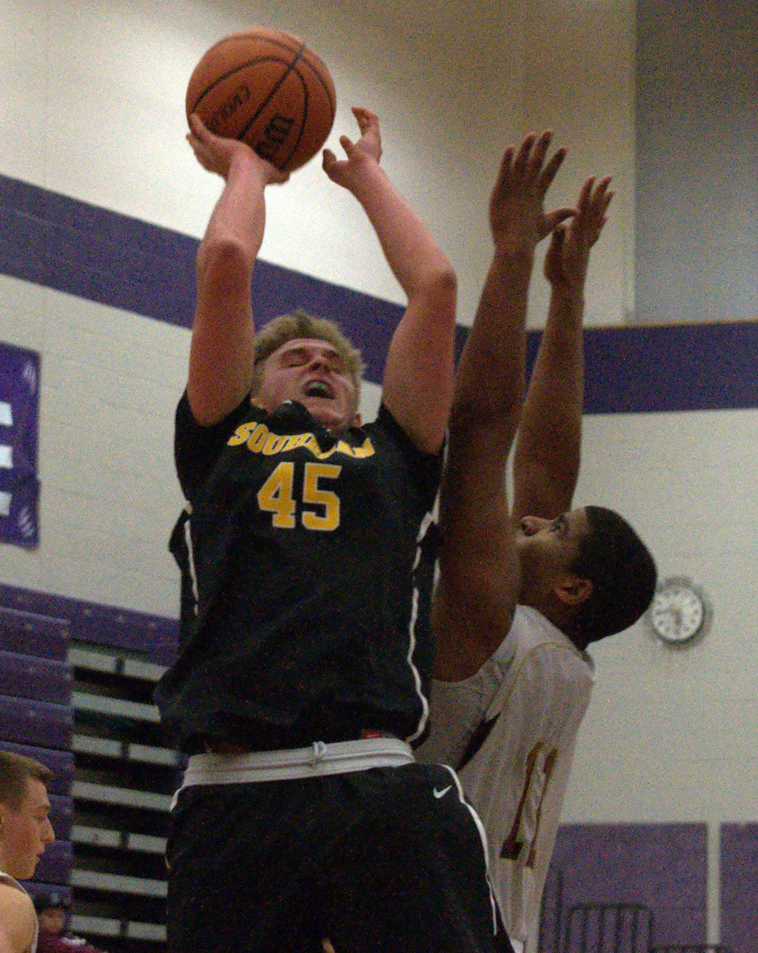 Thornton's Rome Pura defends as Souhegan's Owen Batchelder takes a shot.