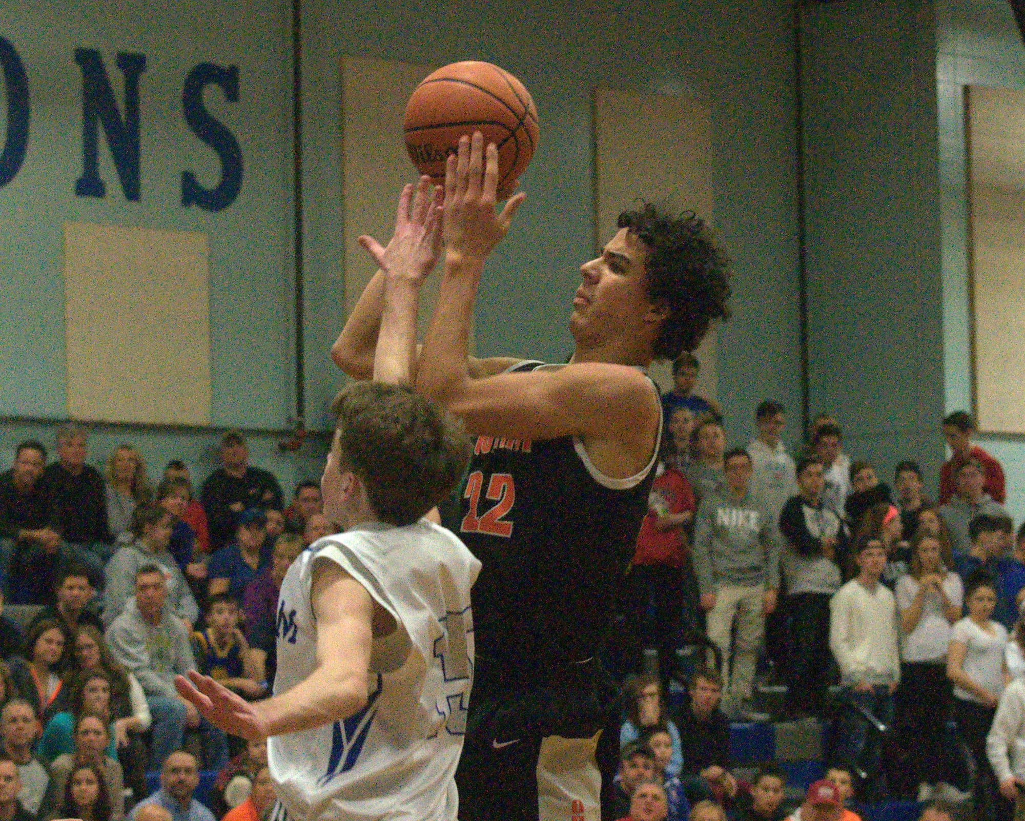 Conant's Brandon Ford tries to shoot as Pelham's Ryan Nystrom defends.