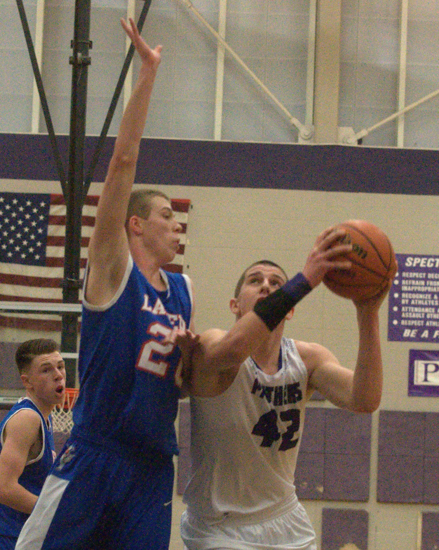 Londonderry's Matt Corey defends as Nashua South's Max Osgood goes to the basket.