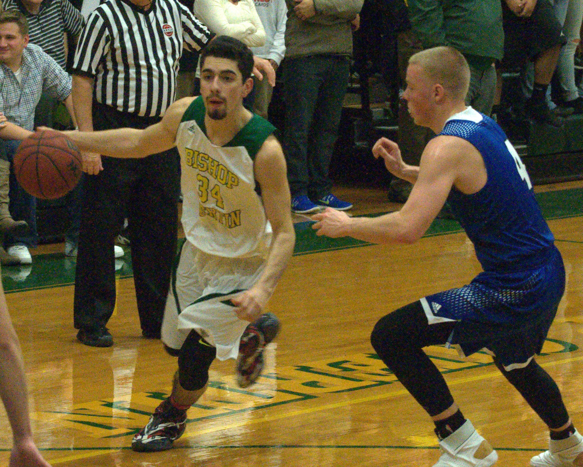 Merrimack's Zak Kerr defends as Bishop Guertin's Emile Hobeika dribbles the ball.