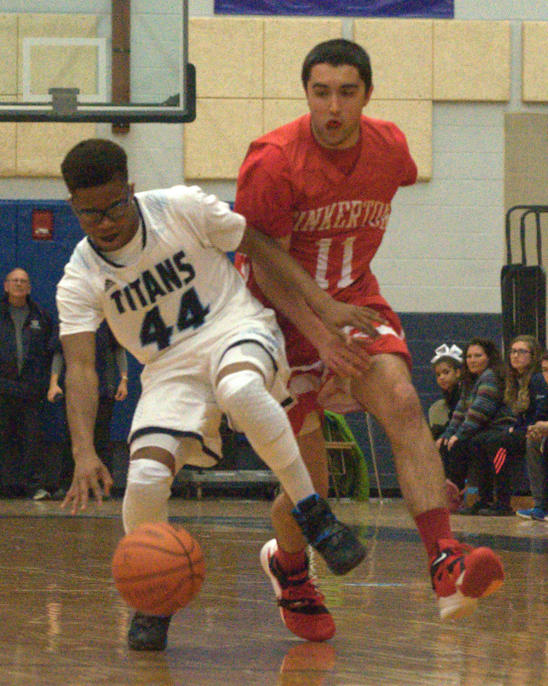 Pinkerton's Matthew Rizzo tries to knock the ball away from Nashua North's Sclyler Boykin.