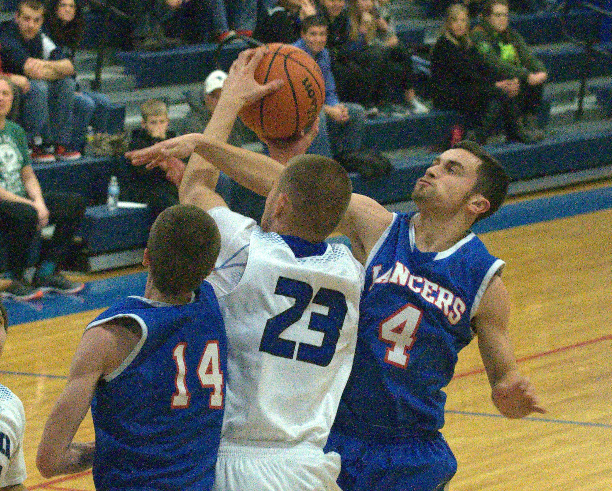 Londonderry's Nate Gaw tries to knock the ball away from Merrimack's AJ Azorian.