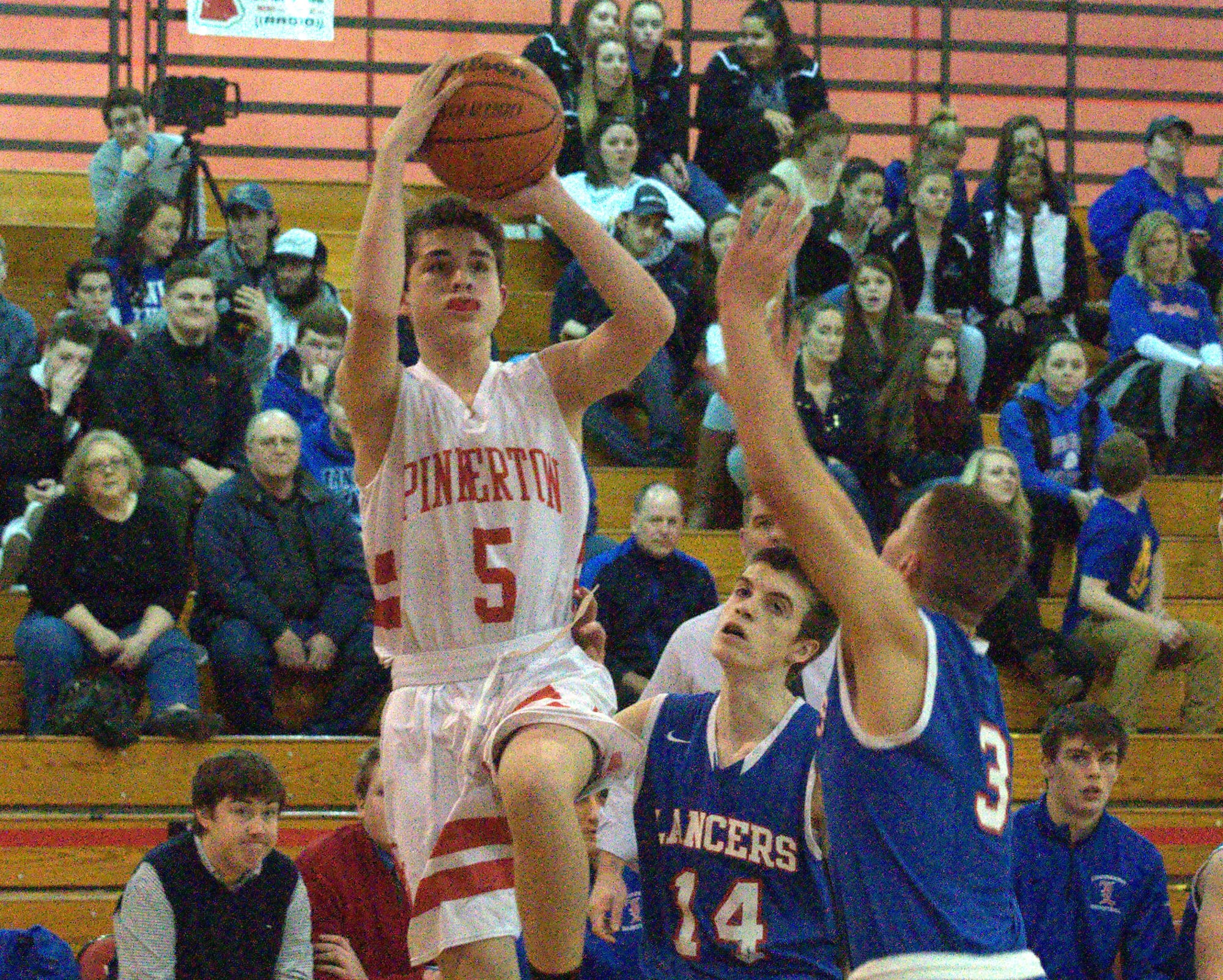 Pinkerton's Joseph Merrill takes a shot as Londonderry's Ethan Garofolo defends.