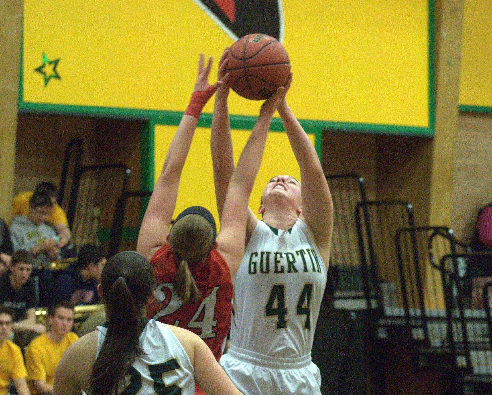 Pinkerton's Sara McLeman and Bishop Guertin's Abbi Field battle for a rebound.