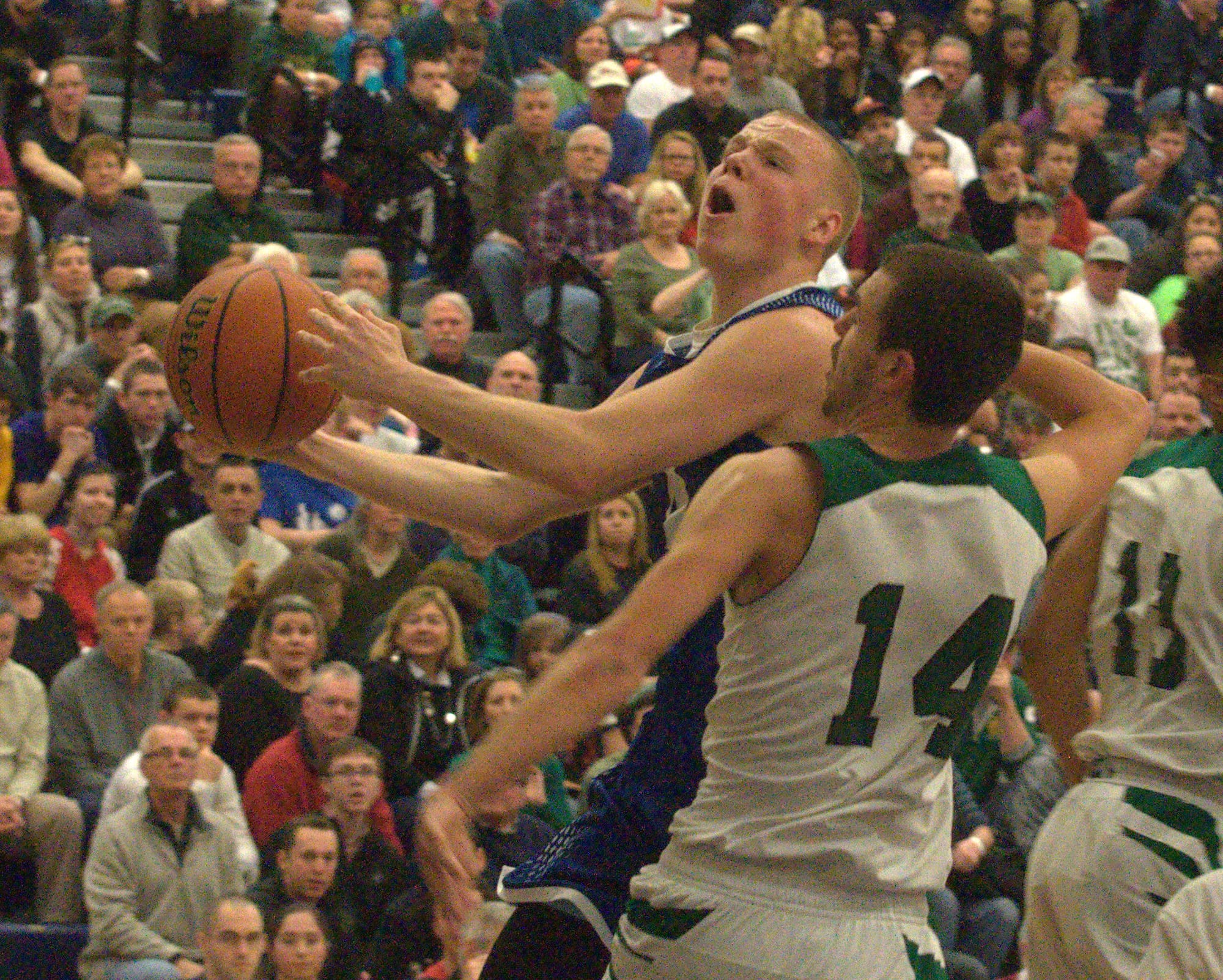Merrimack's Zak Kerr drives to the basket against Manchester Central's Evan MacDonald.