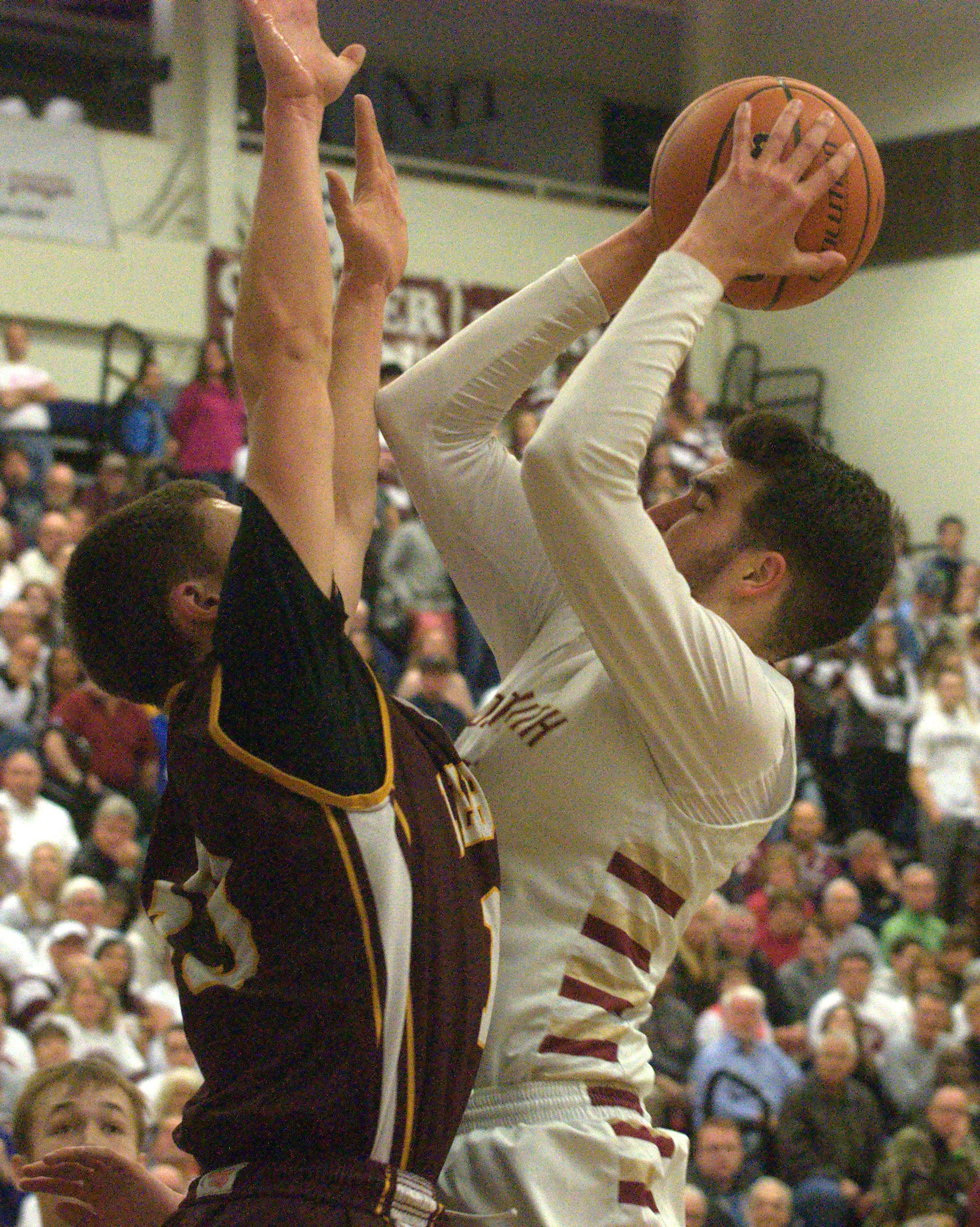 Lebanon's KJ Matte defends as Portsmouth's Joey Glynn puts up a shot.