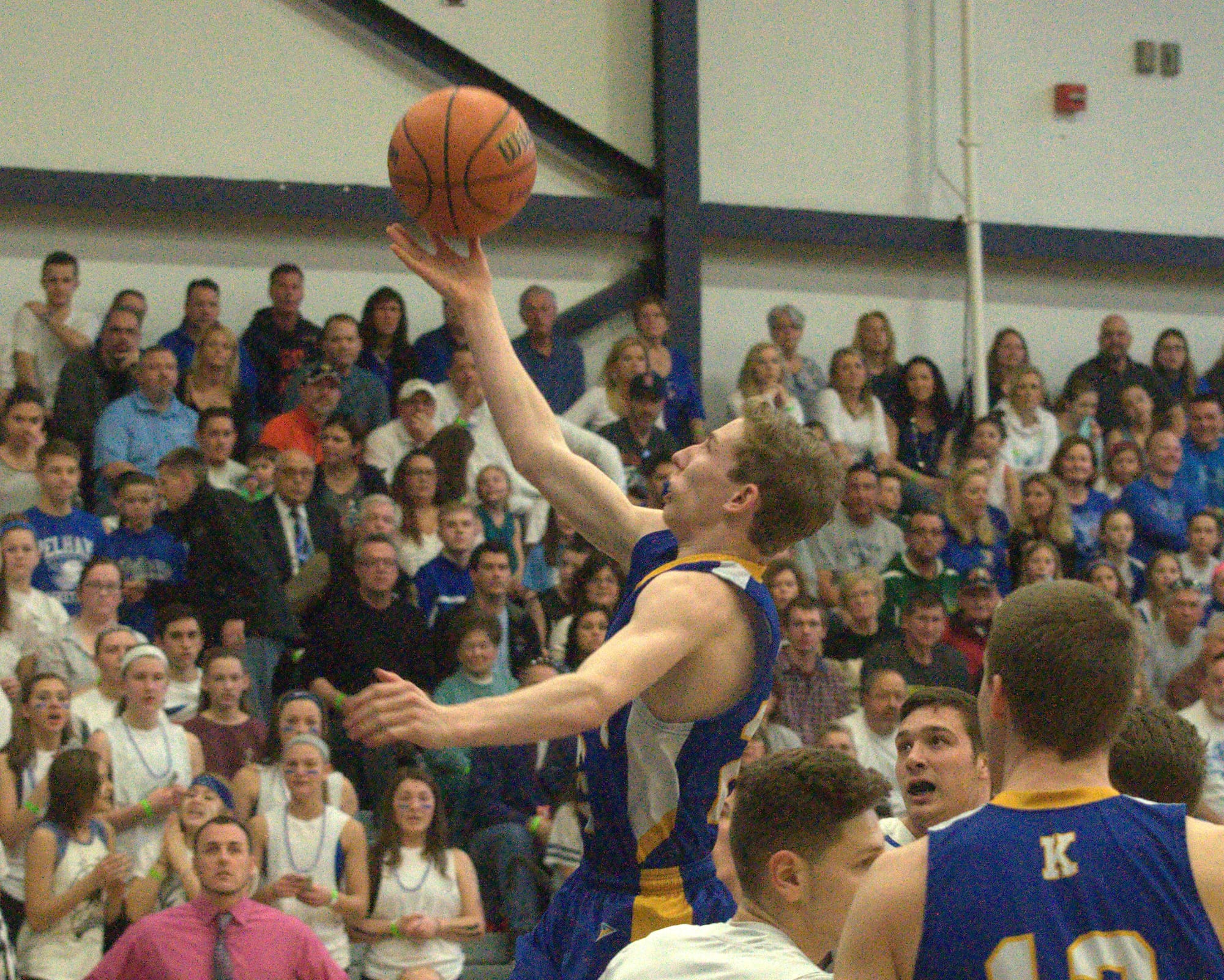 Kearsarge's Thomas Johnson drives to the basket.