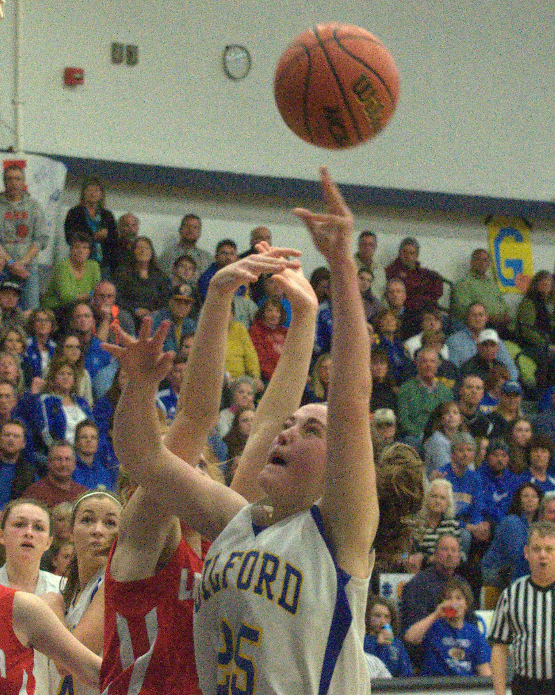 Gilford's Stevie Orton takes a shot as Laconia's Natalie Compton defends.