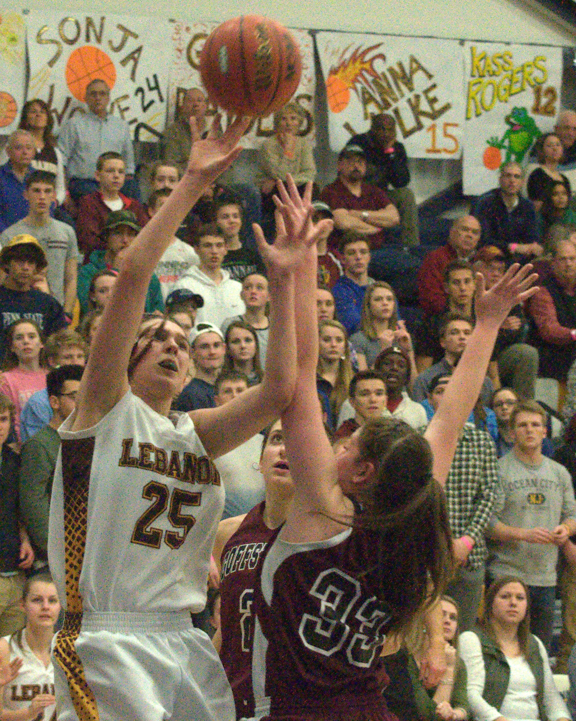 Lebanon's Joslin Wainwright shoots over Goffstown's Kathryn Howe.