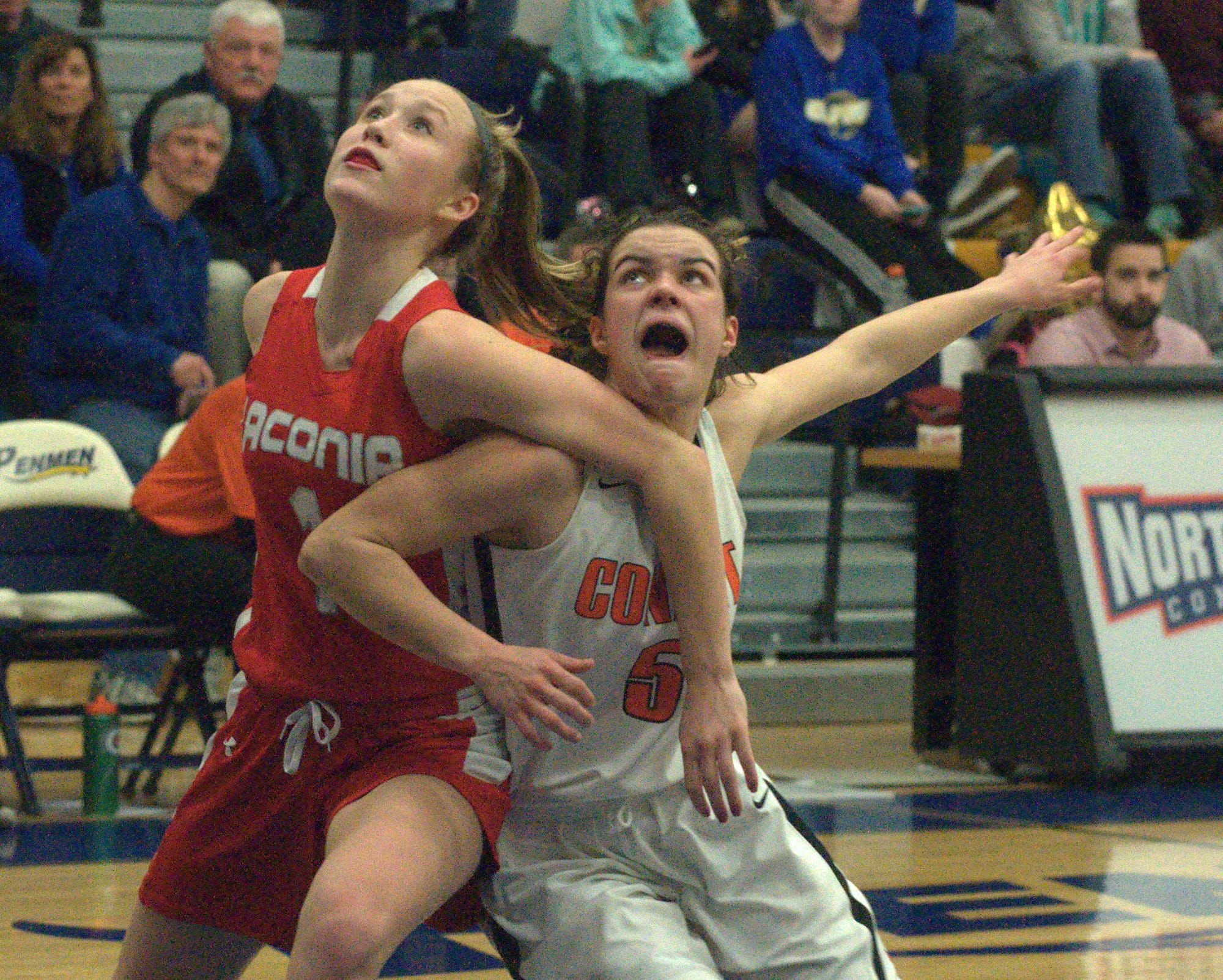 Laconia's Mackenzie Howe and Conant's Megan Wheeler battle for position.